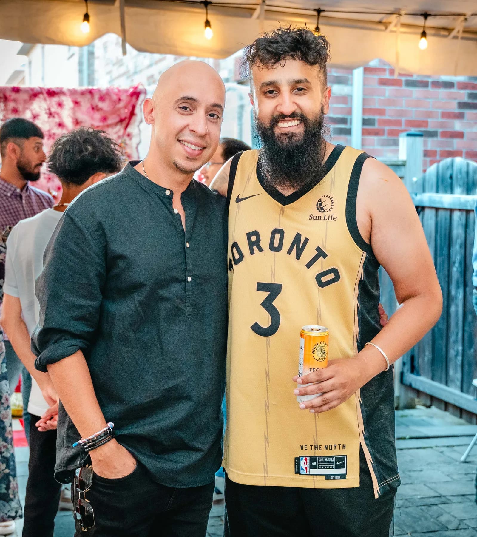 Two men posing together at Aaron’s Haldi celebration.