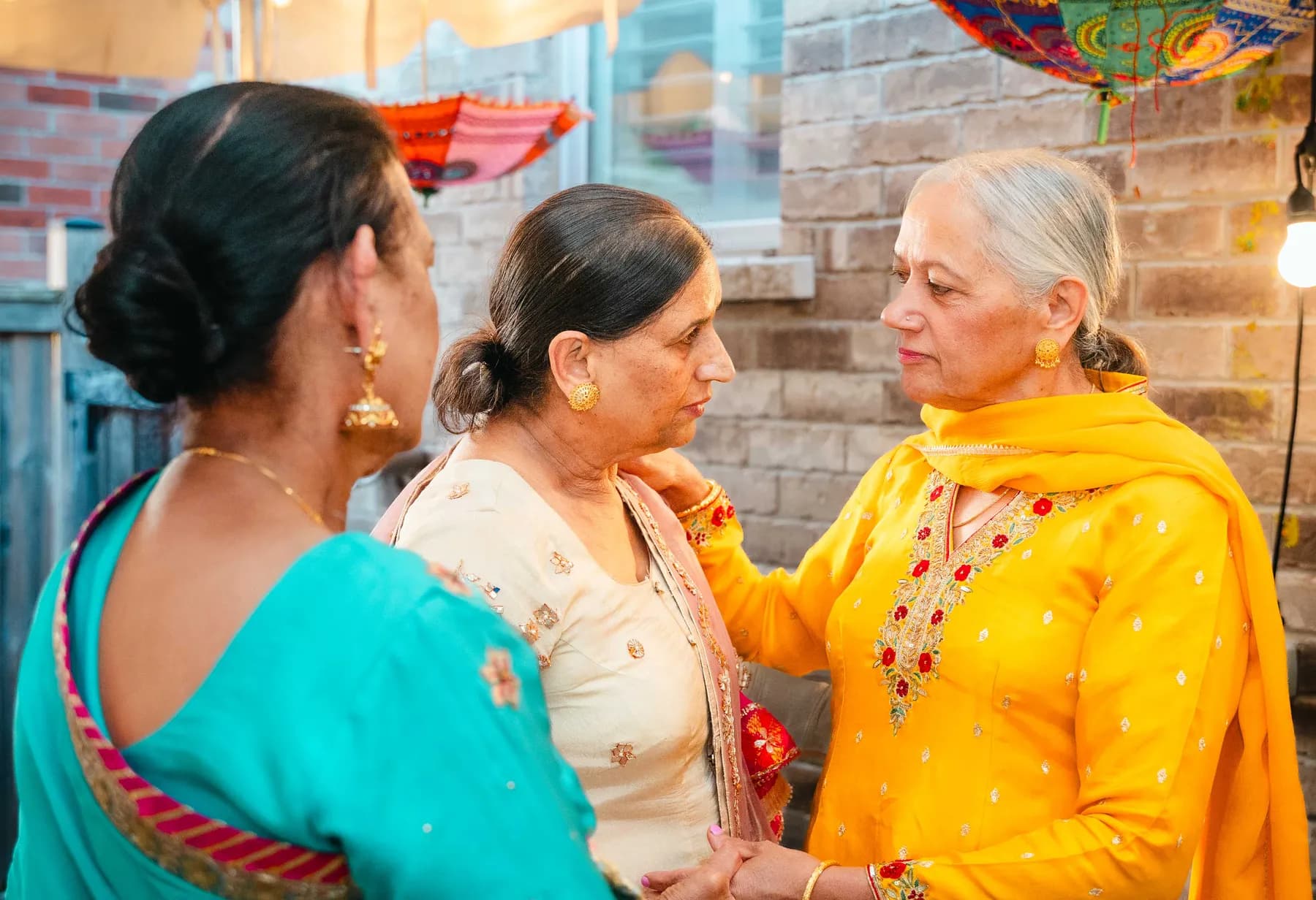 Guests talking and posing together at Aaron’s Haldi celebration.