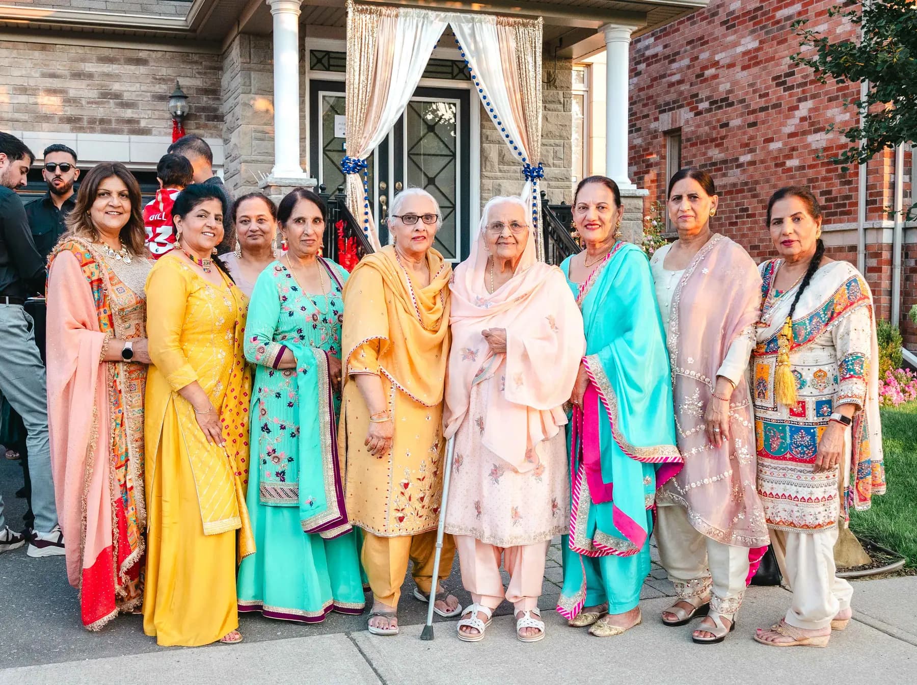 Women gathered outdoors at Aaron’s Haldi celebration.