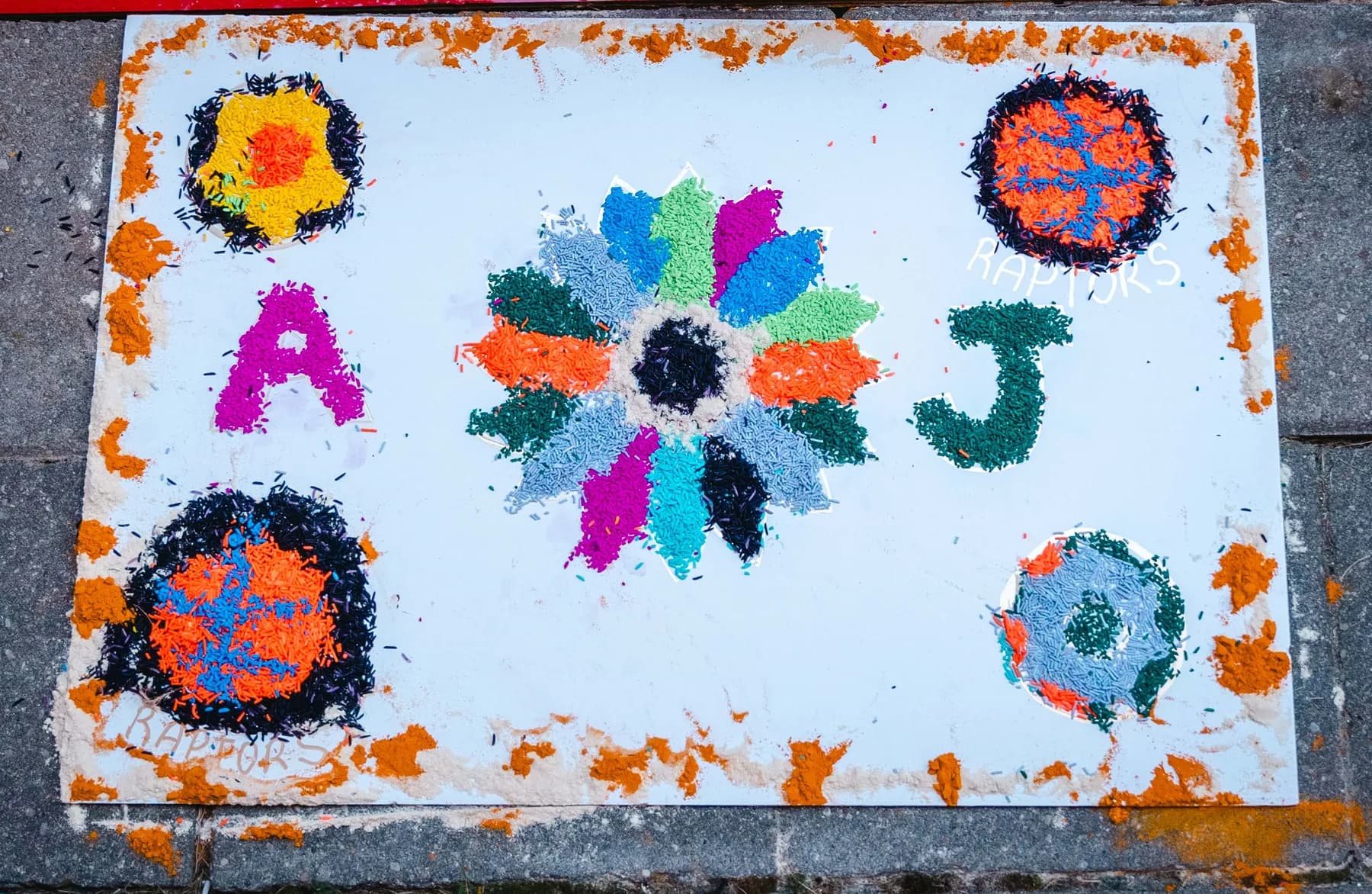 Colourful rangoli artwork at Aaron’s Haldi celebration.