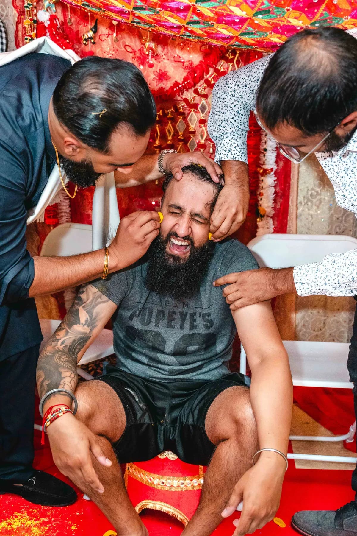 Guests gathered around the Haldi ceremony at Aaron’s Haldi celebration.