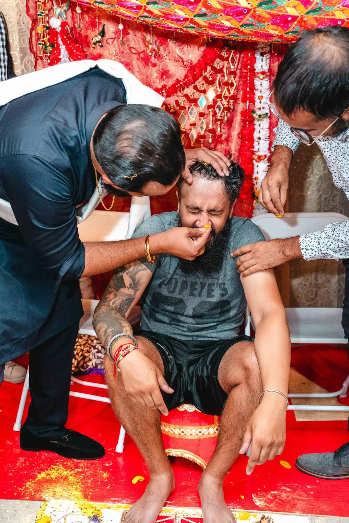 Guests gathered around the Haldi ceremony at Aaron’s Haldi celebration.