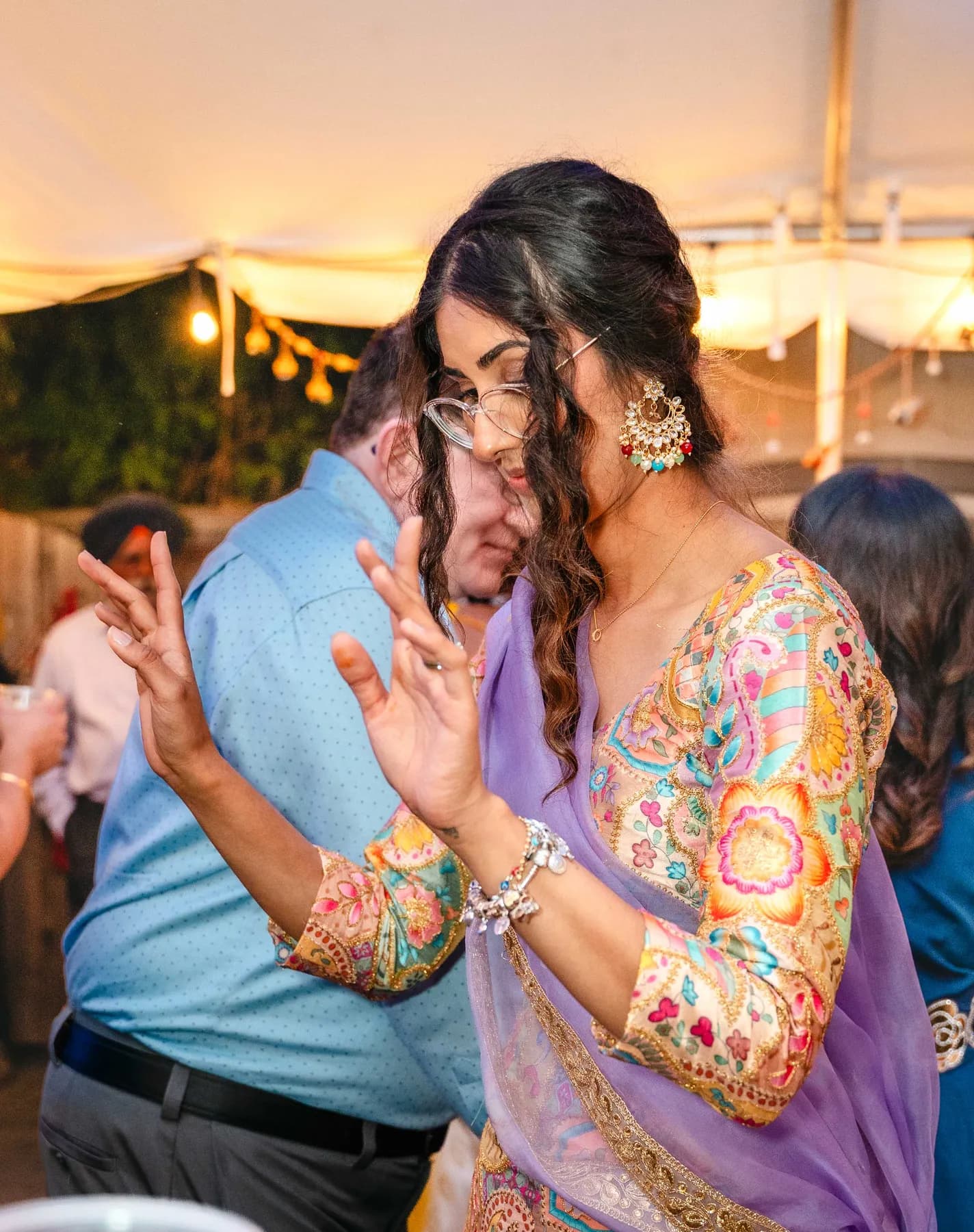 A candid moment between two guests at Aaron’s Haldi celebration.