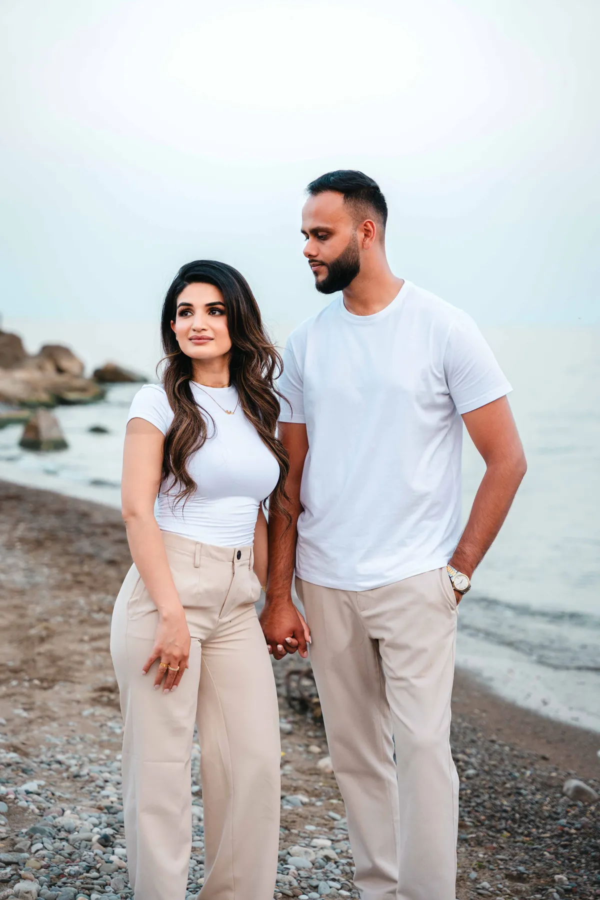 The couple together on the beach at A and F’s couples session.