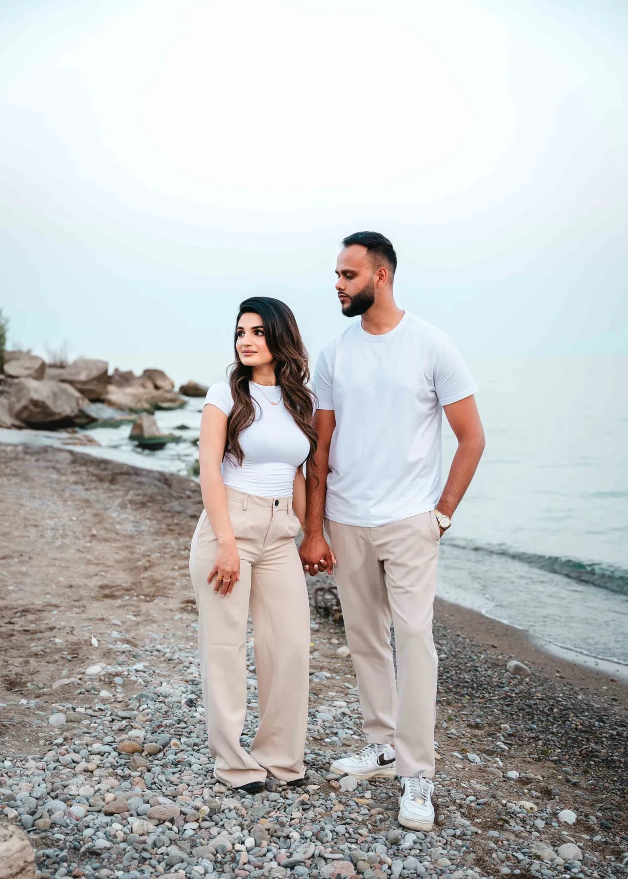 The couple together on the beach at A and F’s couples session.