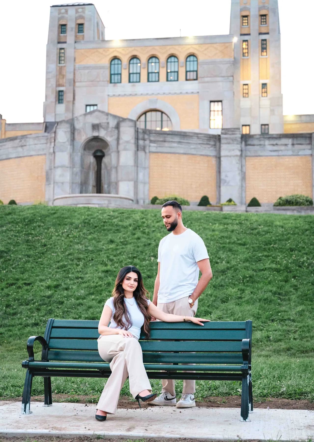 The couple beside a park bench at A and F’s couples session.