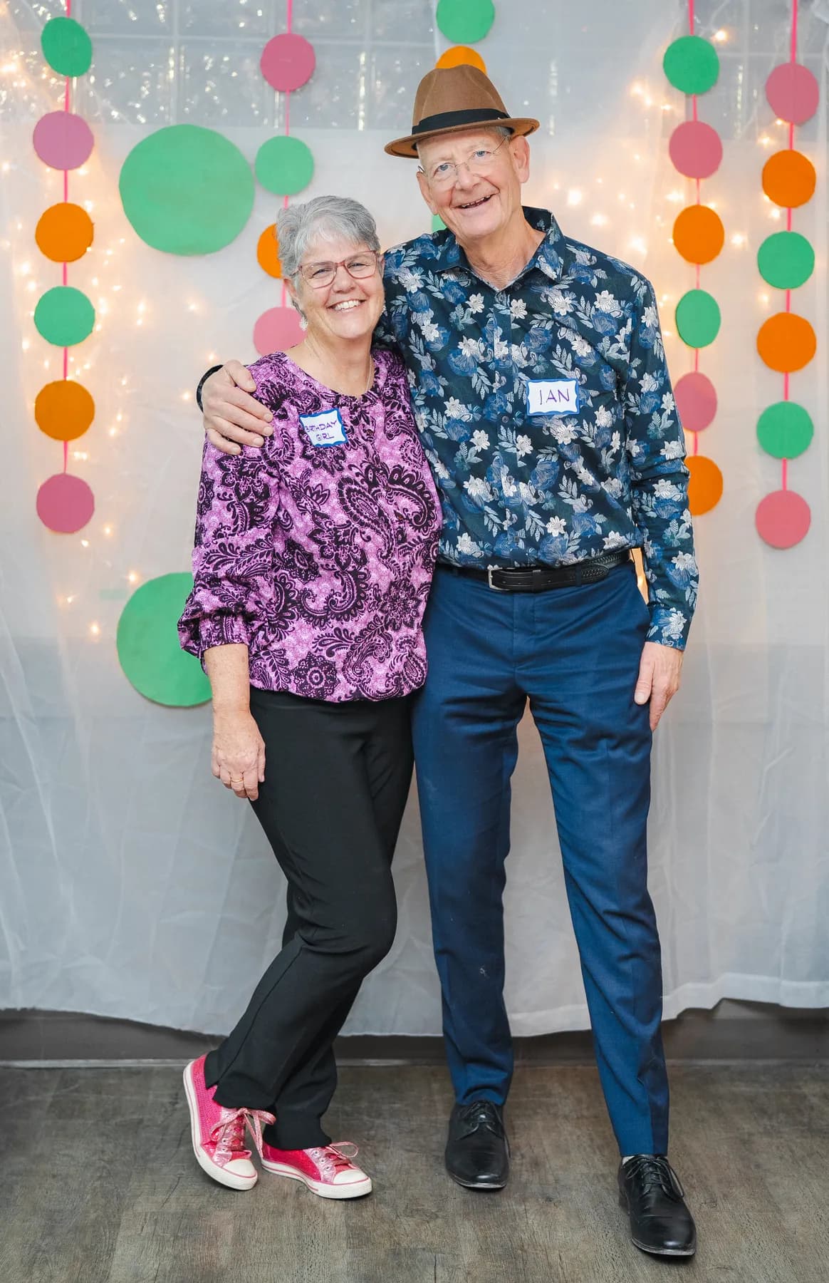 Two guests laughing and posing together at Alison’s birthday celebration.