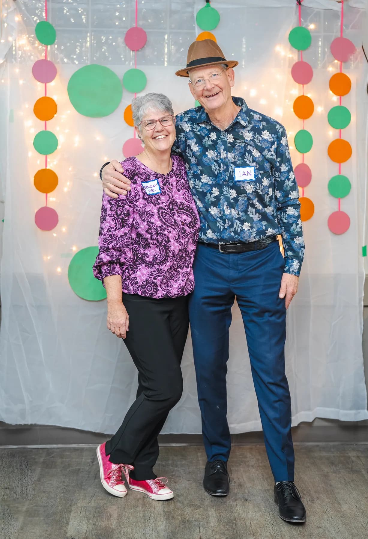 Two guests laughing and posing together at Alison’s birthday celebration.