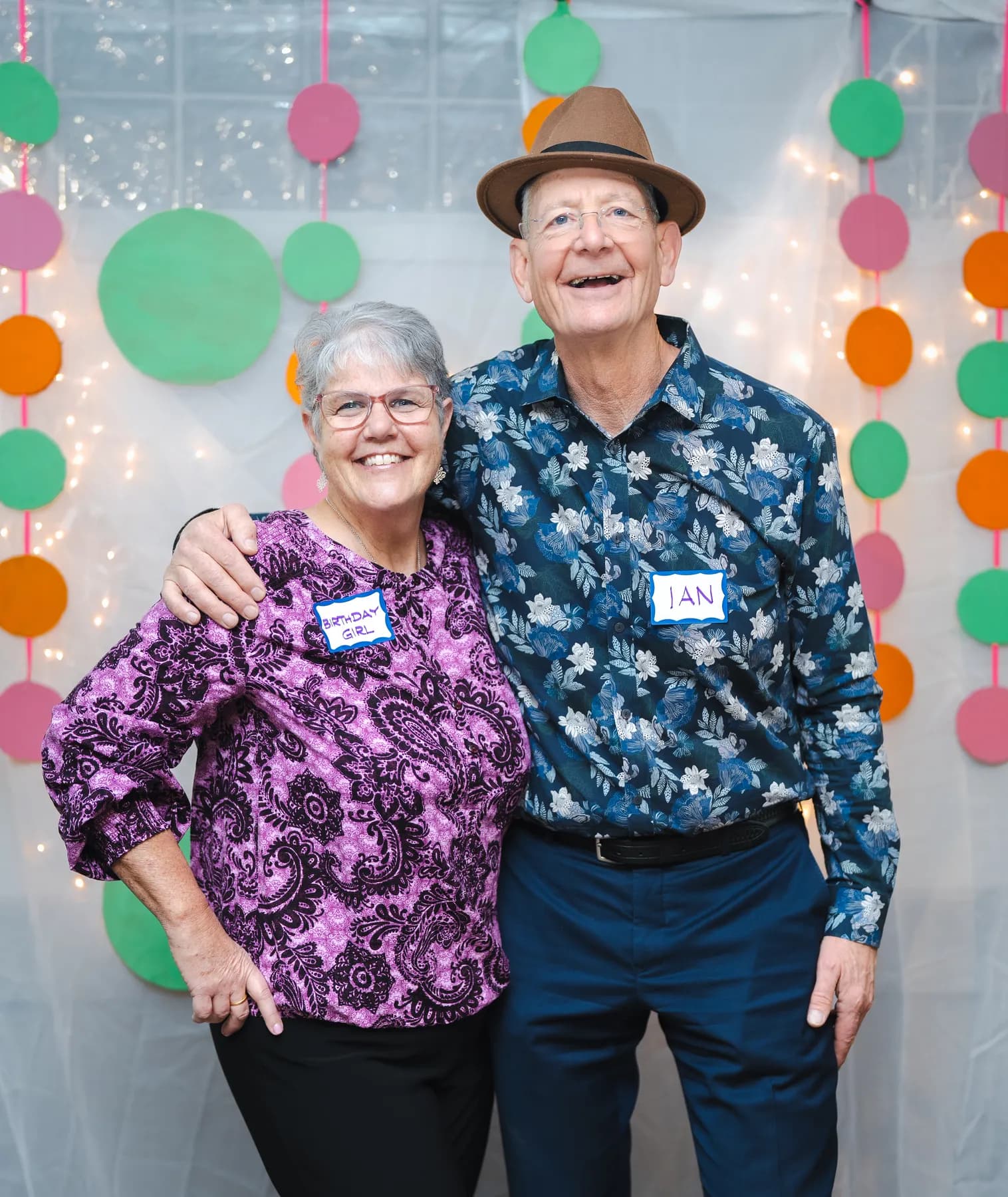 Two guests laughing and posing together at Alison’s birthday celebration.
