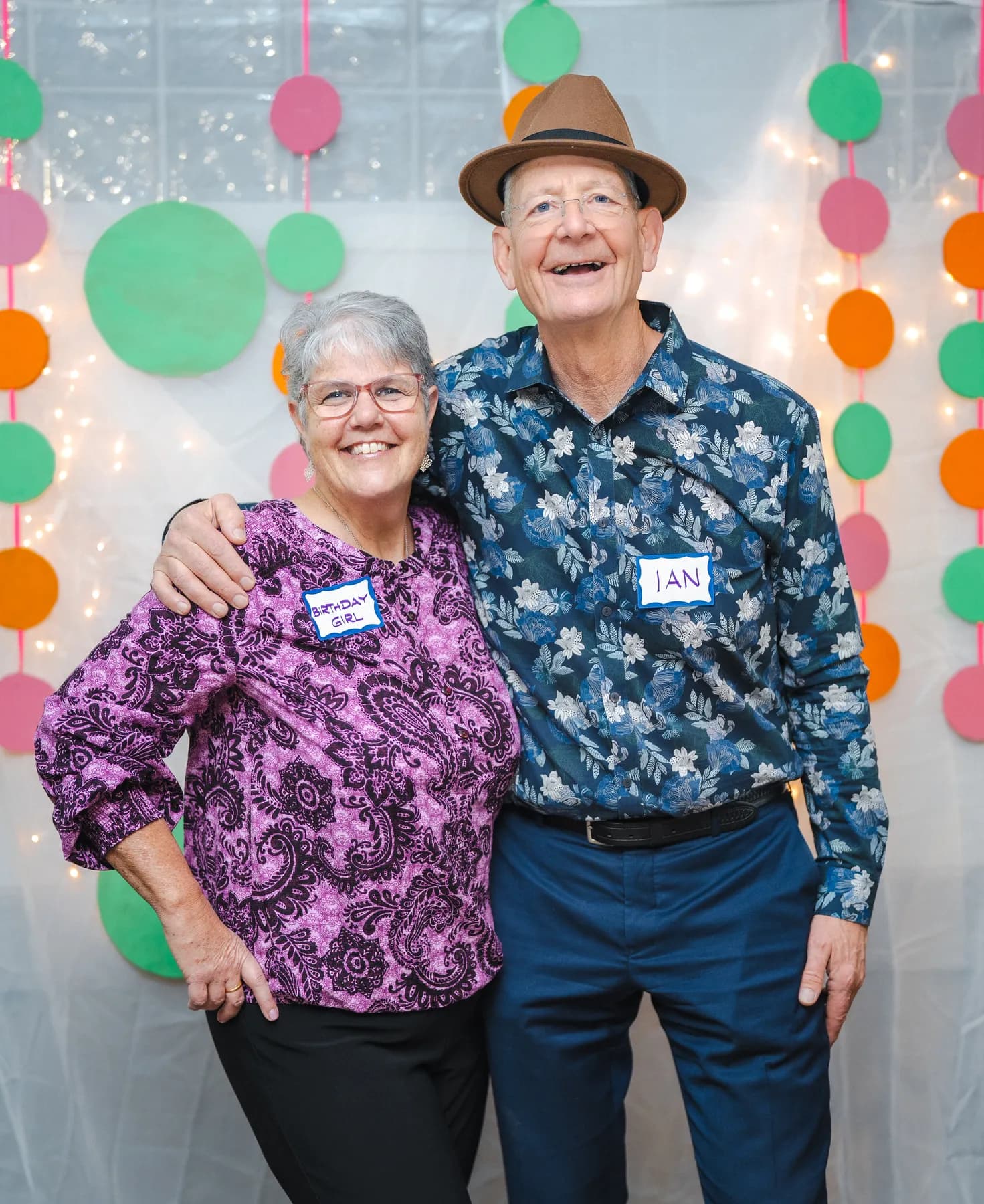 Two guests laughing and posing together at Alison’s birthday celebration.