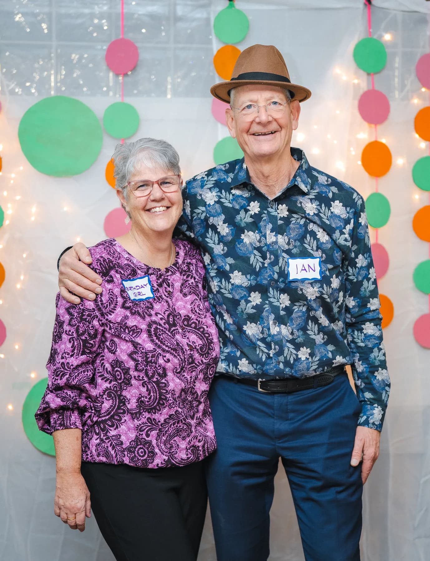 Two guests laughing and posing together at Alison’s birthday celebration.