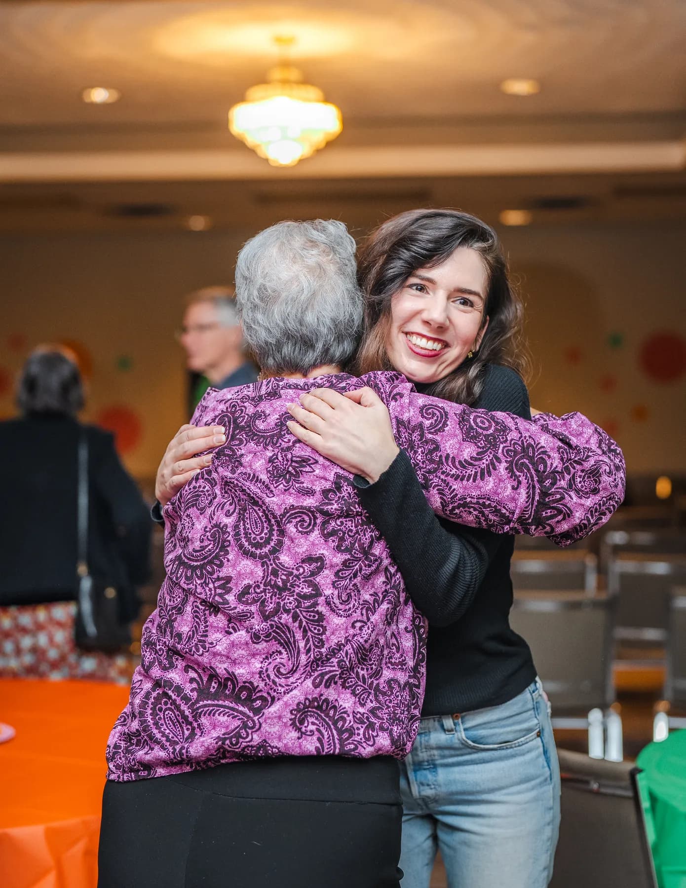 Guests sharing a hug at Alison’s birthday celebration.