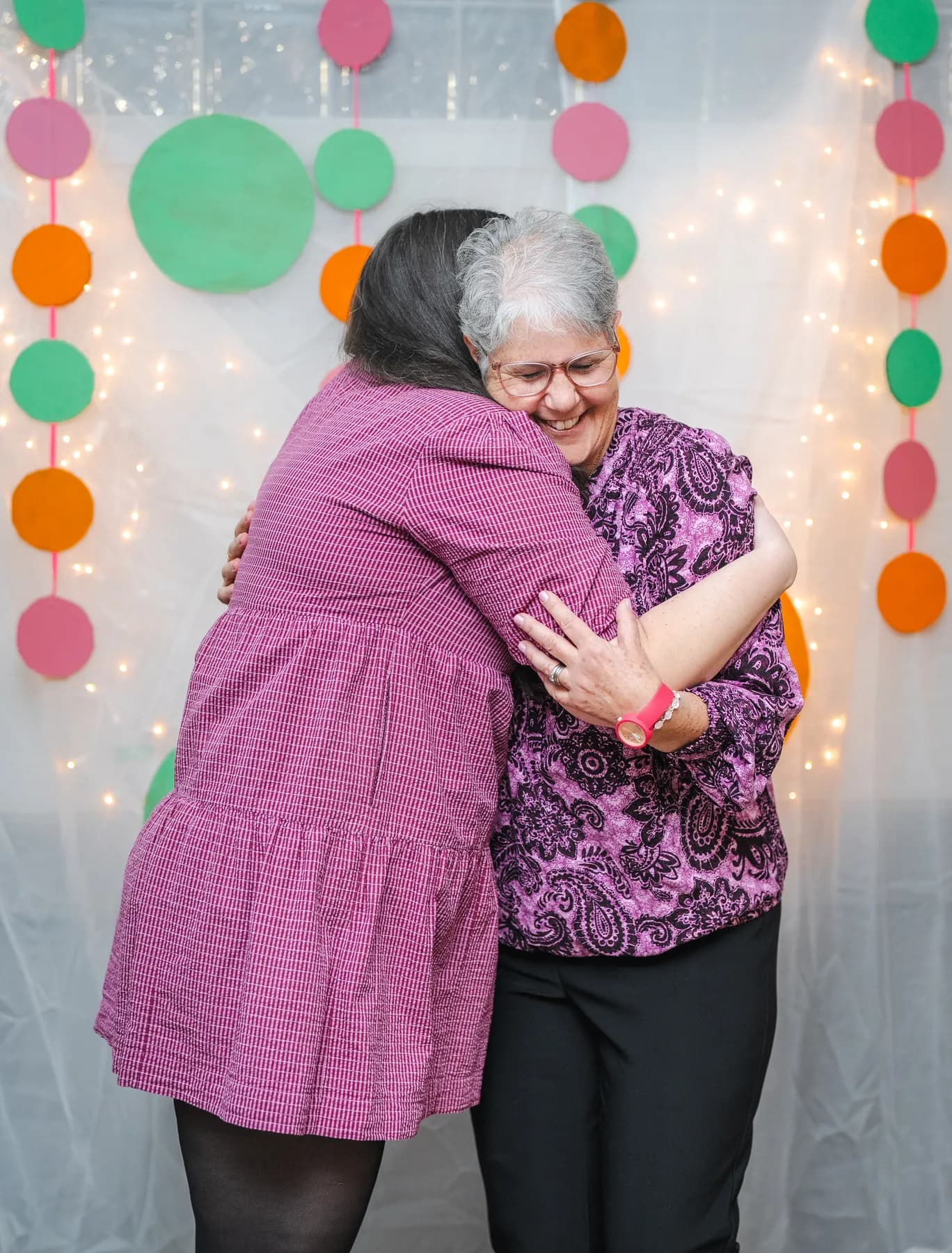 Guests sharing a hug at Alison’s birthday celebration.
