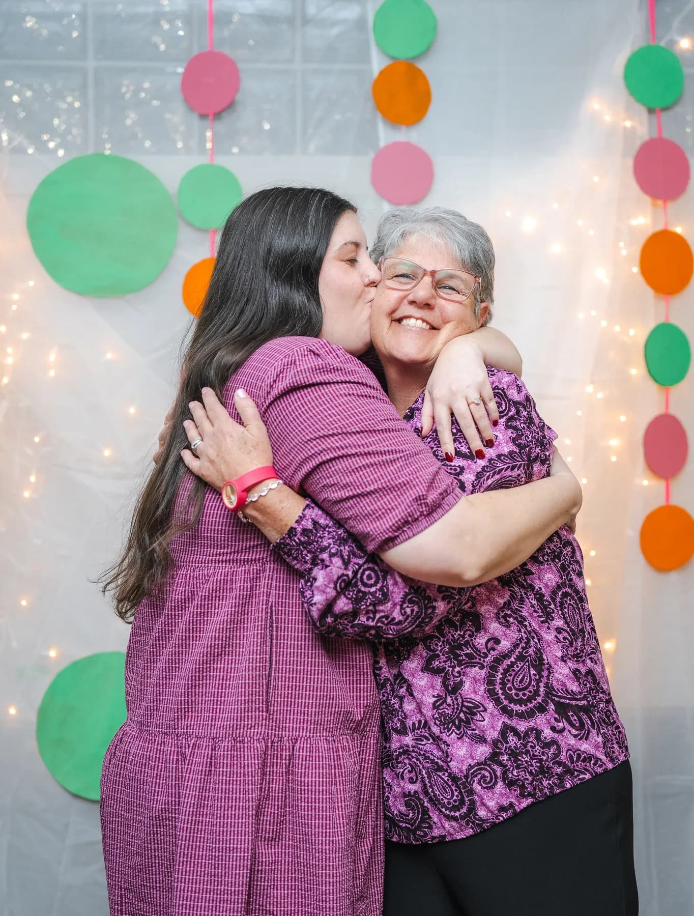 Guests sharing a hug at Alison’s birthday celebration.