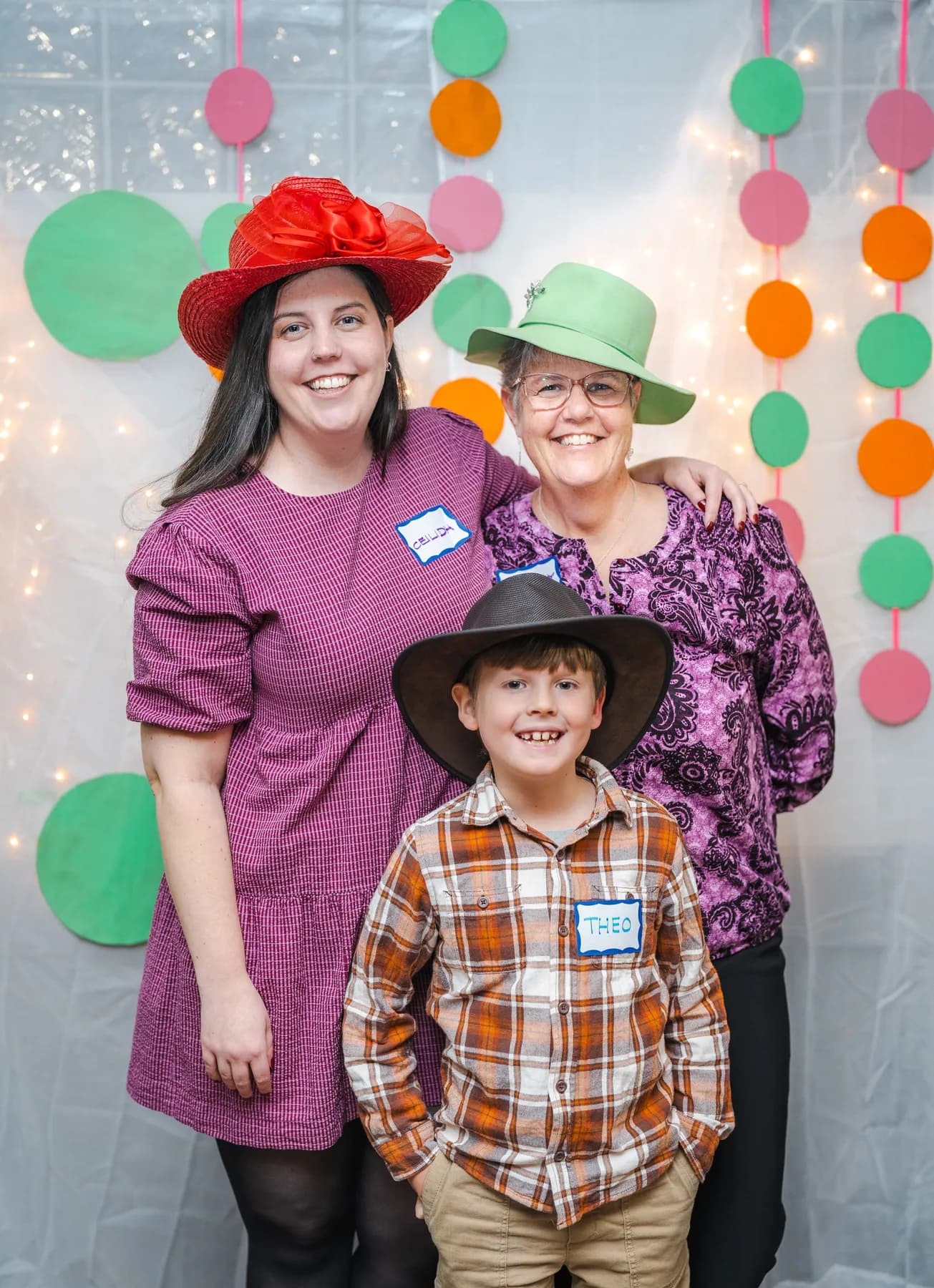 Guests posing in playful hats at Alison’s birthday celebration.