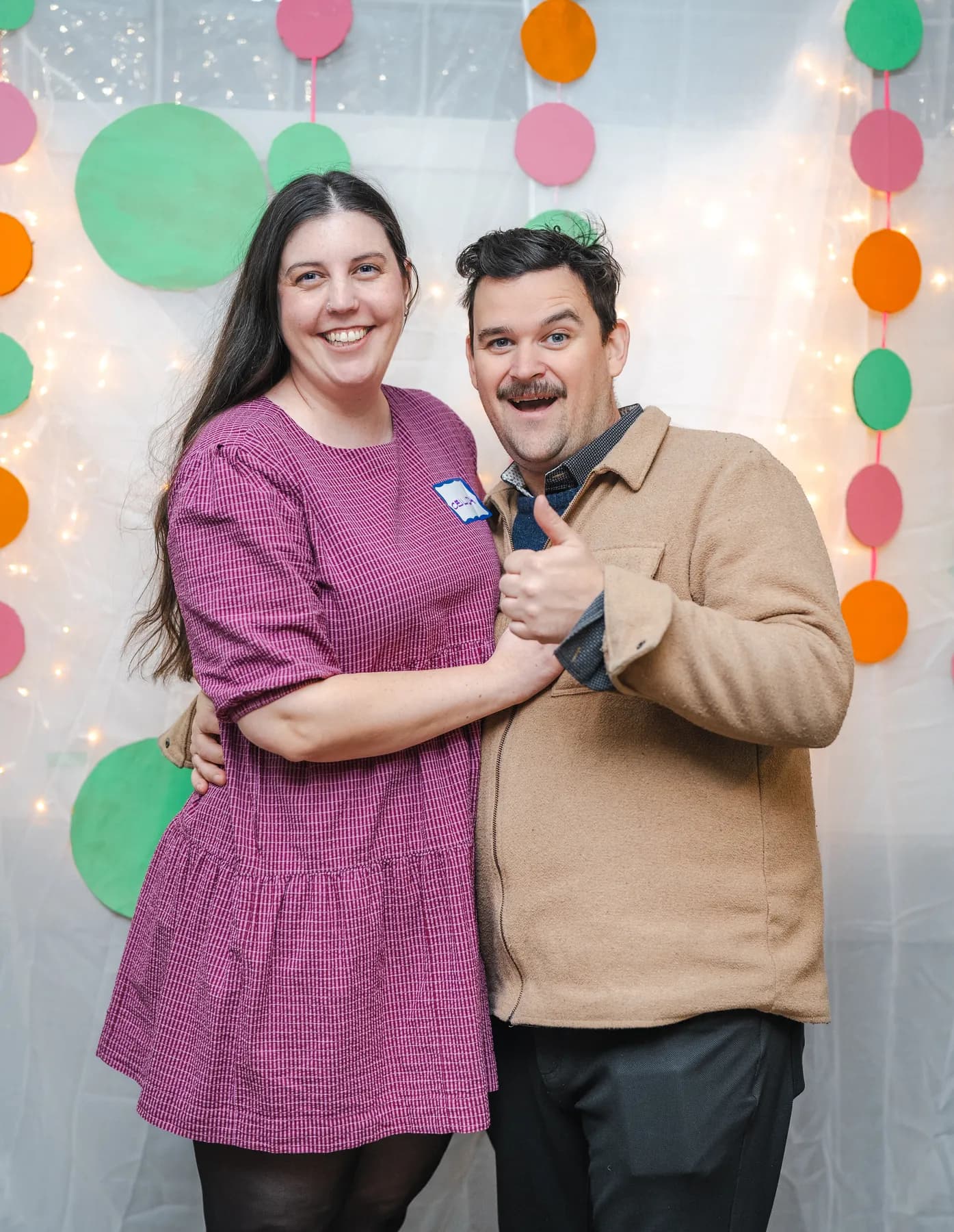 A couple posing together at Alison’s birthday celebration.