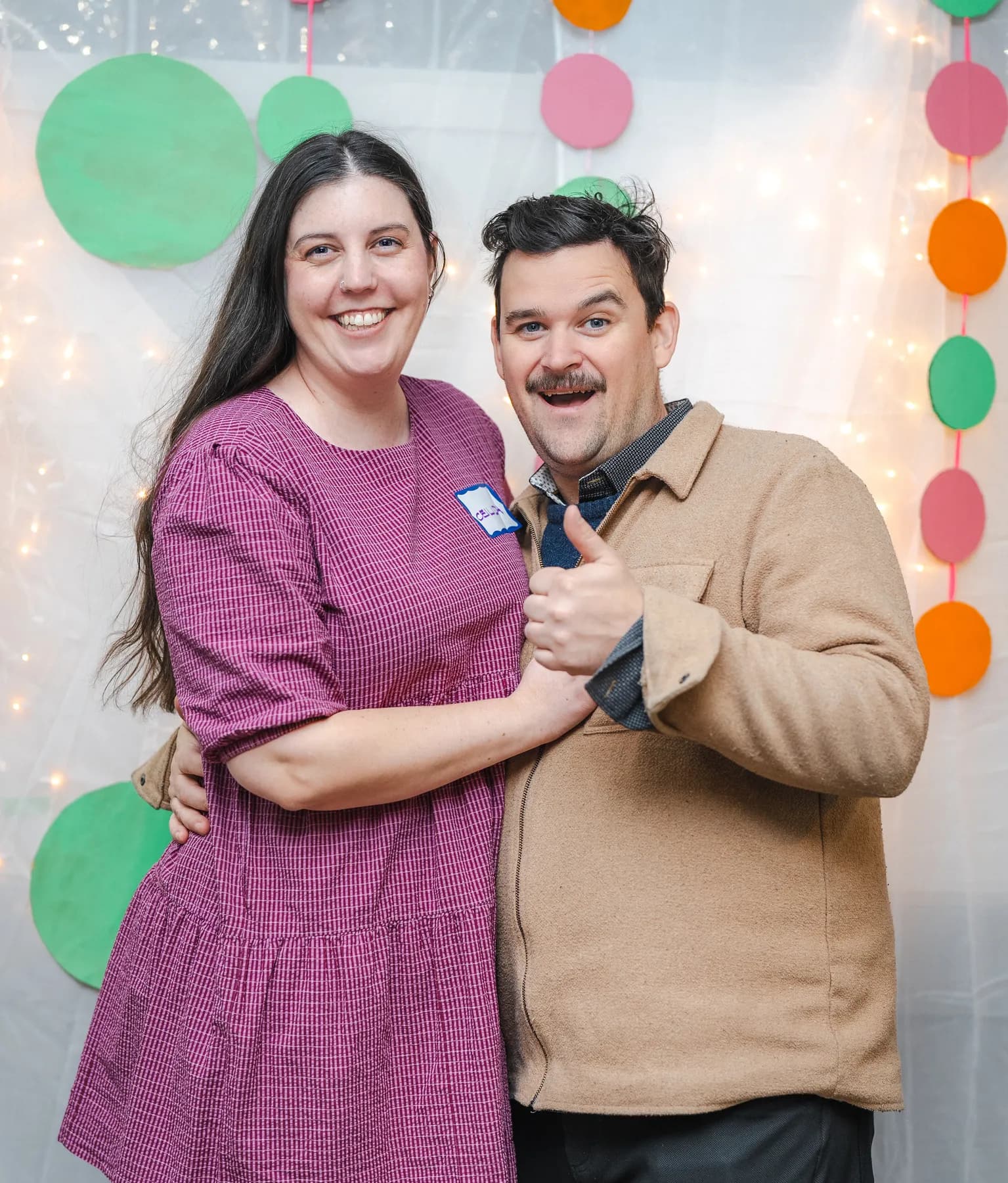 A couple posing together at Alison’s birthday celebration.
