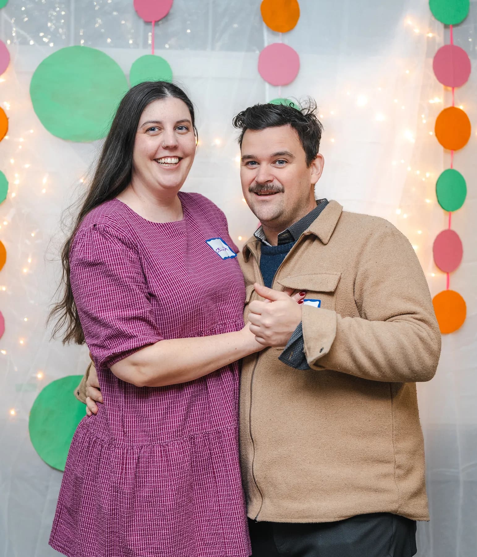 A couple posing together at Alison’s birthday celebration.