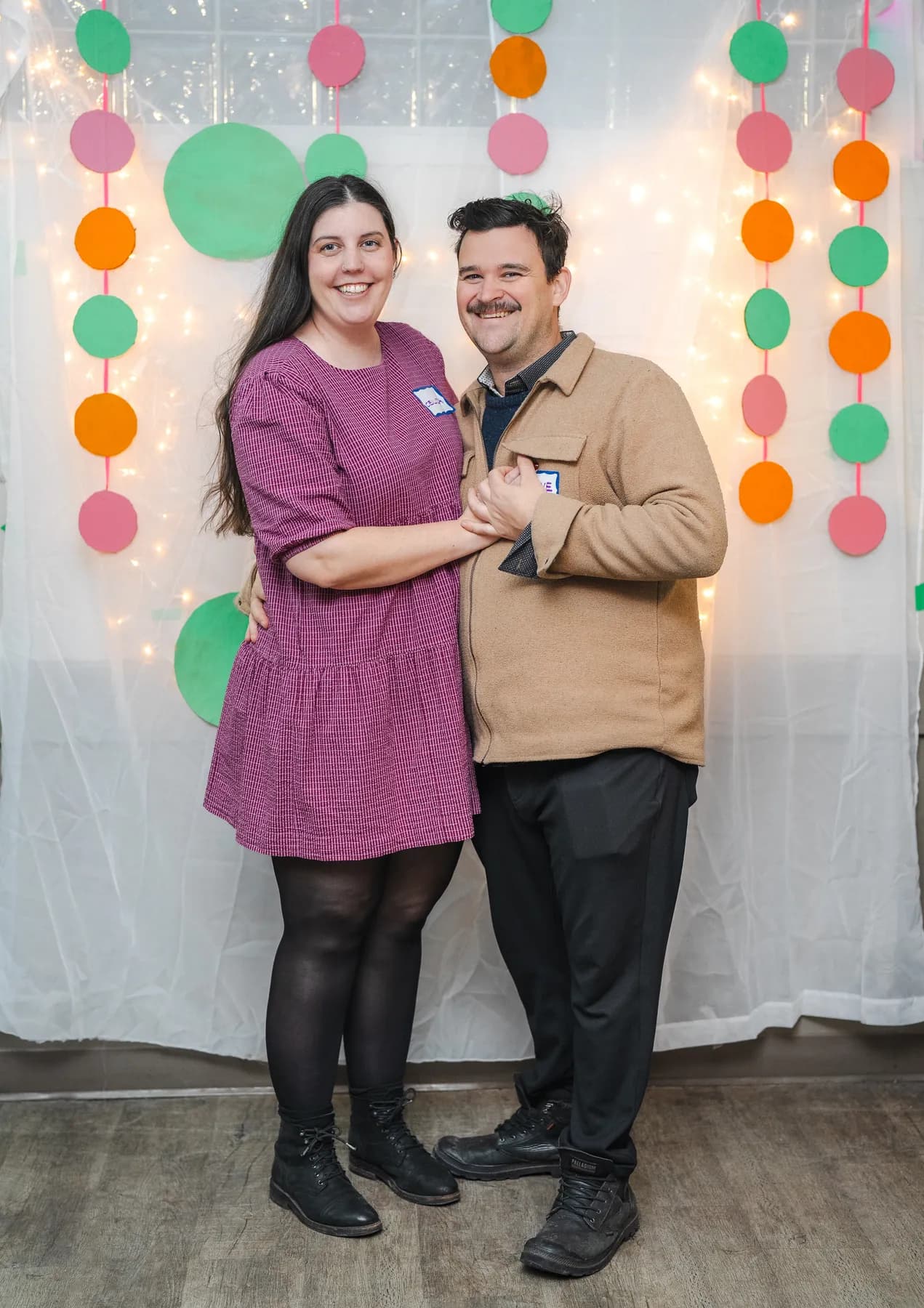 A couple posing together at Alison’s birthday celebration.