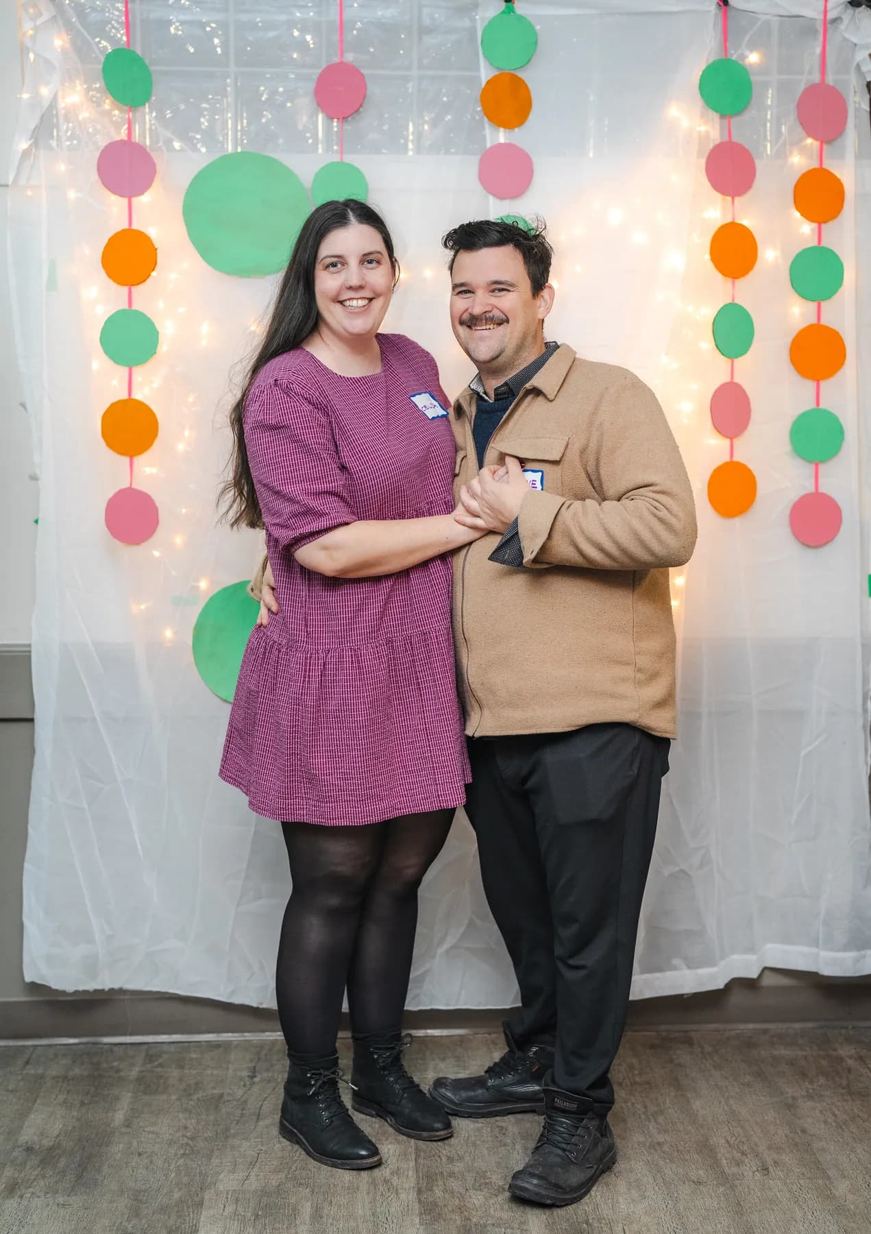 A couple posing together at Alison’s birthday celebration.