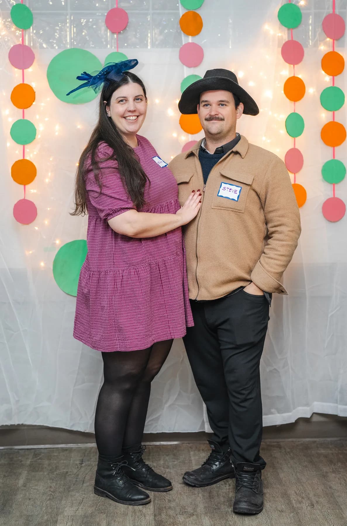 Guests posing in playful hats at Alison’s birthday celebration.