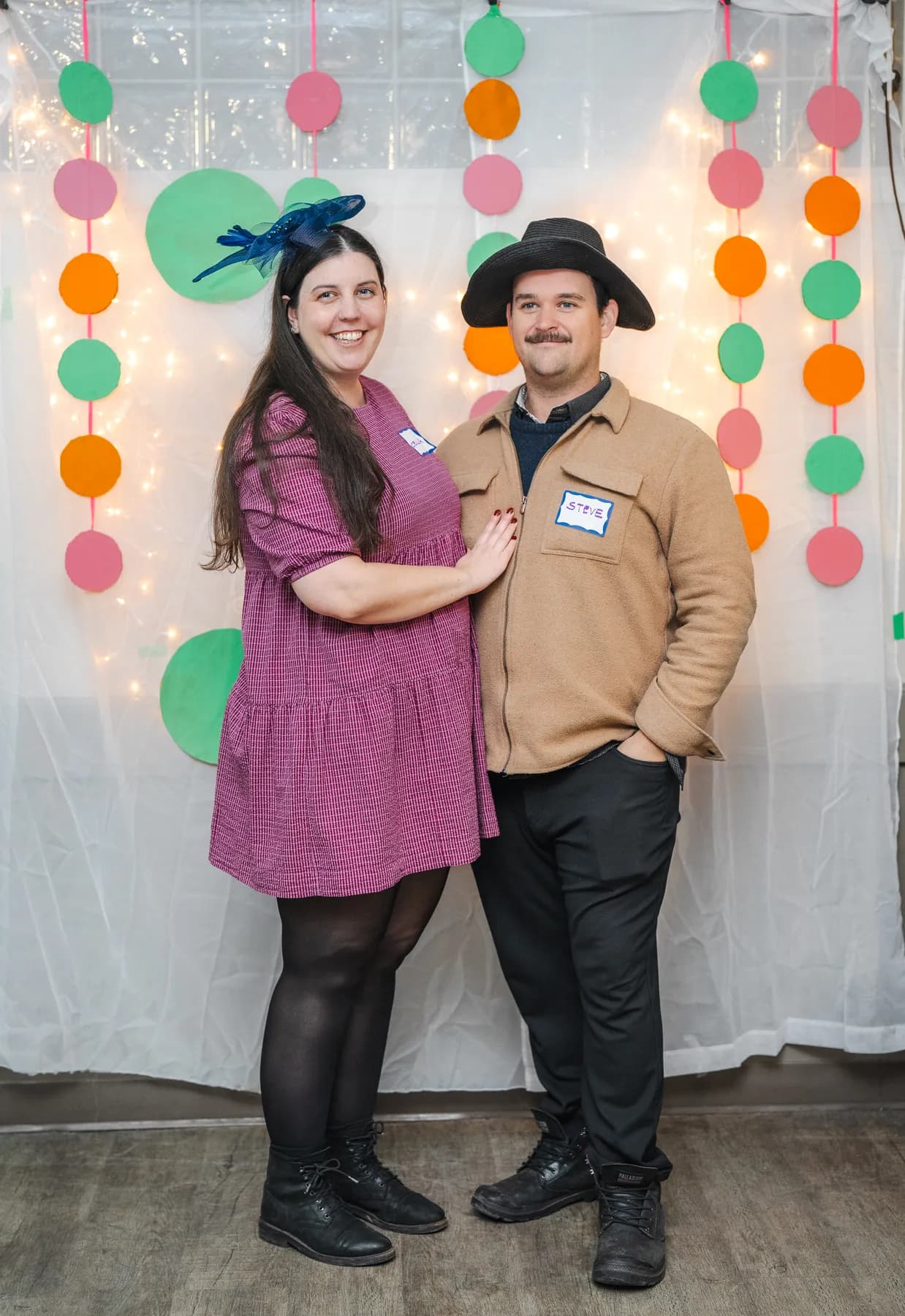 Guests posing in playful hats at Alison’s birthday celebration.