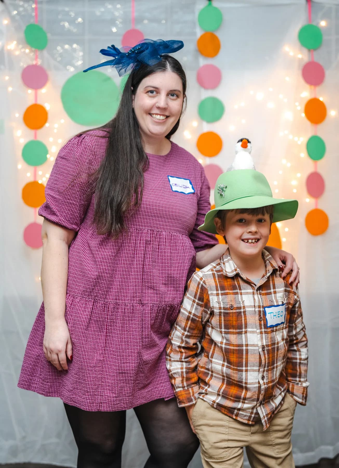 Guests posing in playful hats at Alison’s birthday celebration.