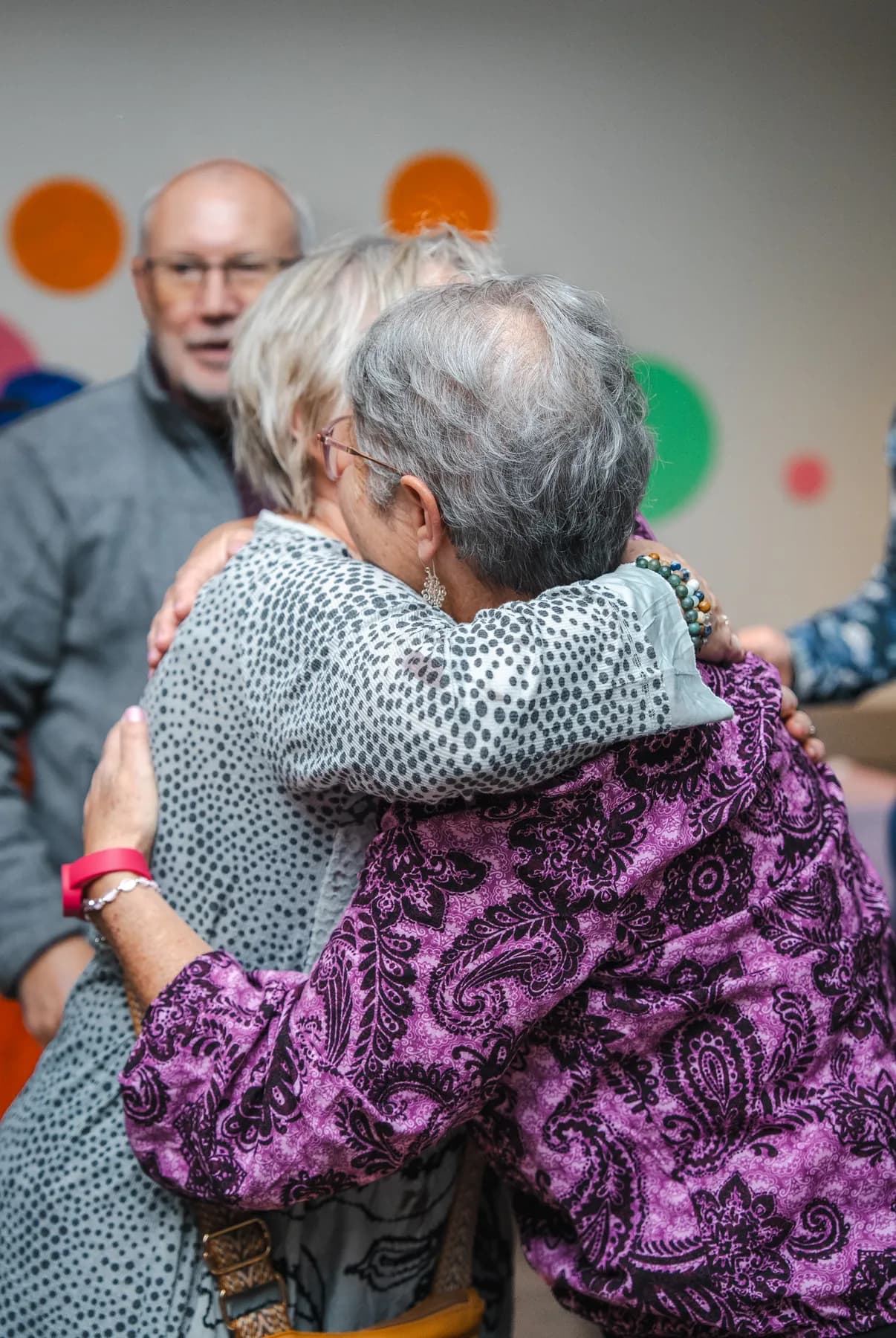 Guests sharing a hug at Alison’s birthday celebration.
