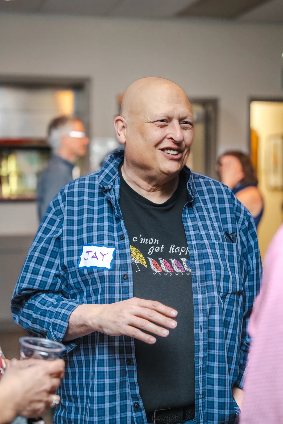A guest smiling at Alison’s birthday celebration.