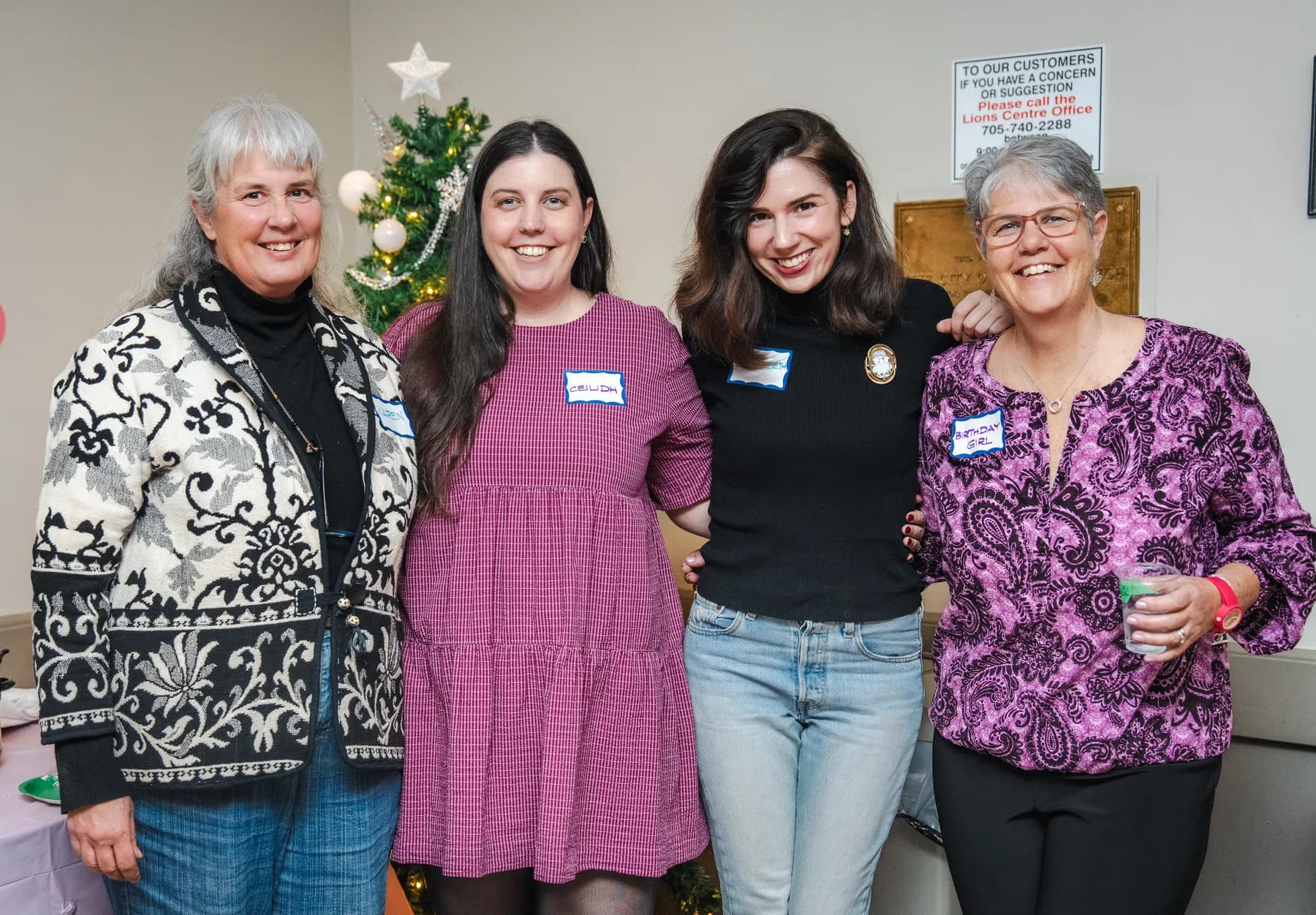 Four women posing together at Alison’s birthday celebration.