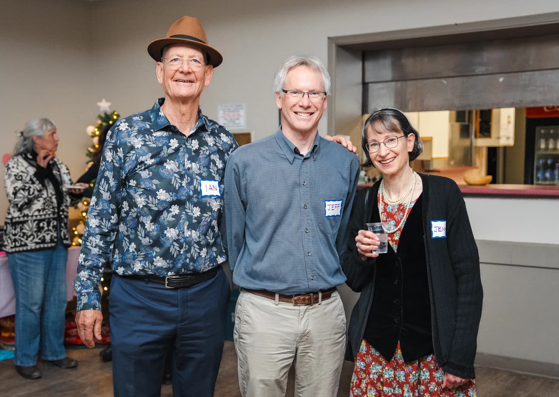 Three guests posing together at Alison’s birthday celebration.