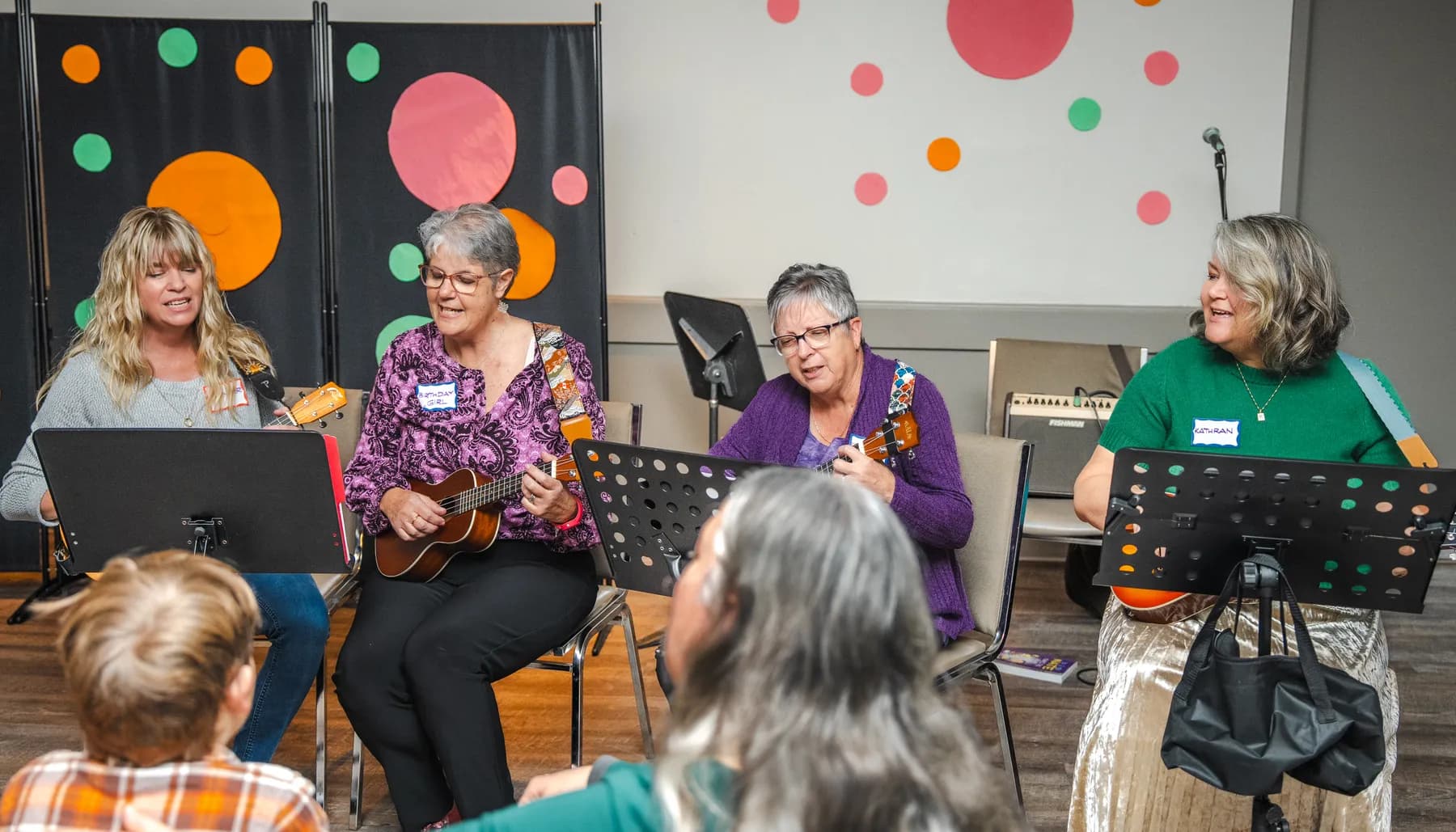 Musicians playing ukuleles at Alison’s birthday celebration.