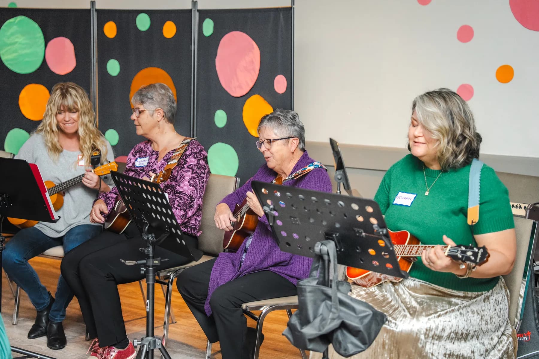 Musicians playing ukuleles at Alison’s birthday celebration.