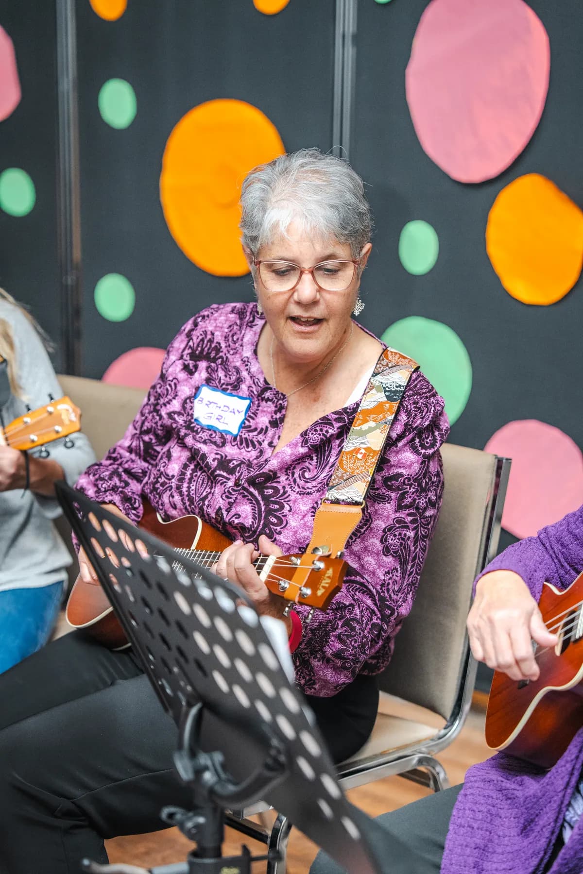 Musicians playing ukuleles at Alison’s birthday celebration.