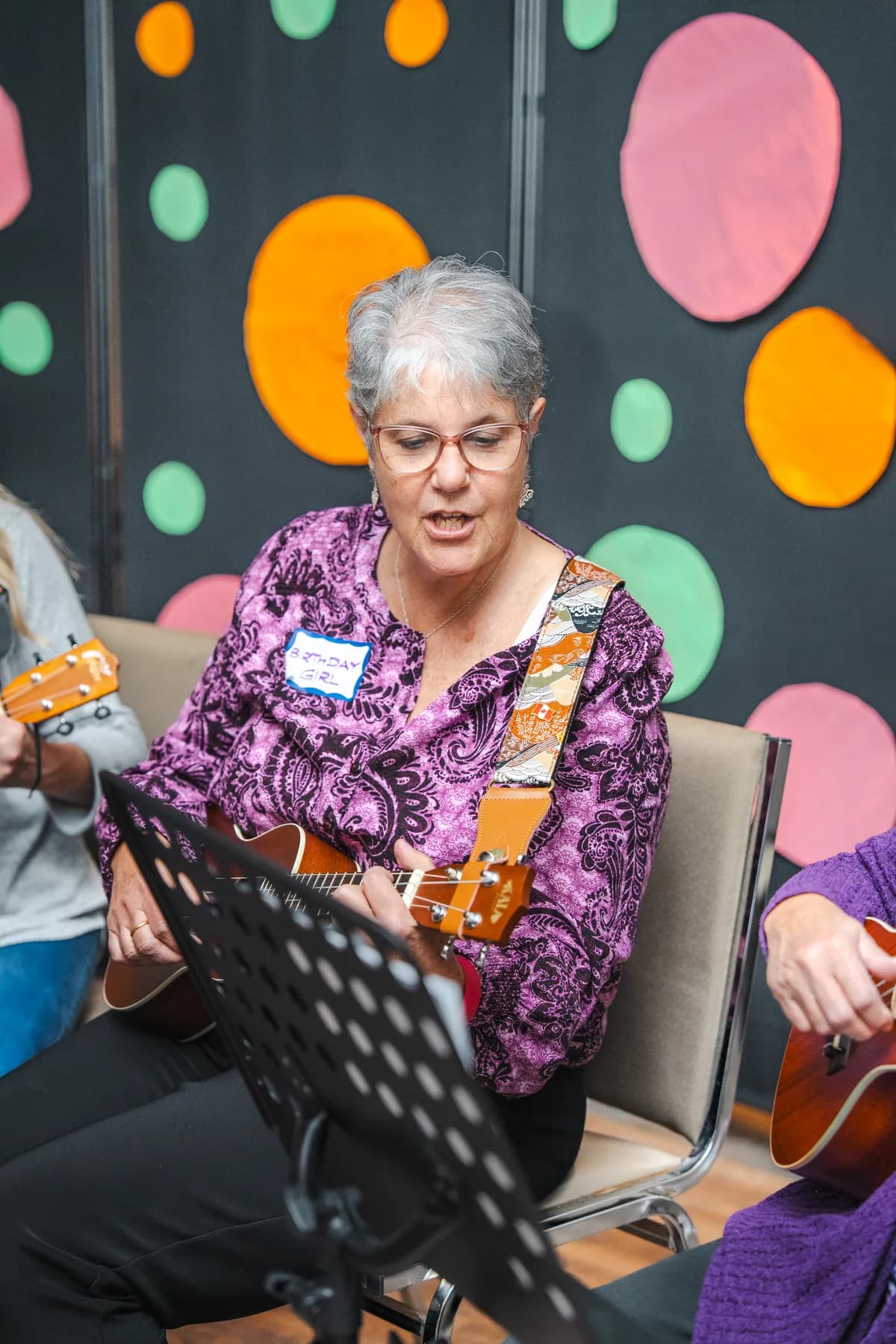 Musicians playing ukuleles at Alison’s birthday celebration.