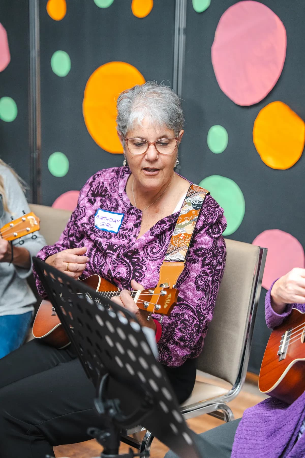 Musicians playing ukuleles at Alison’s birthday celebration.