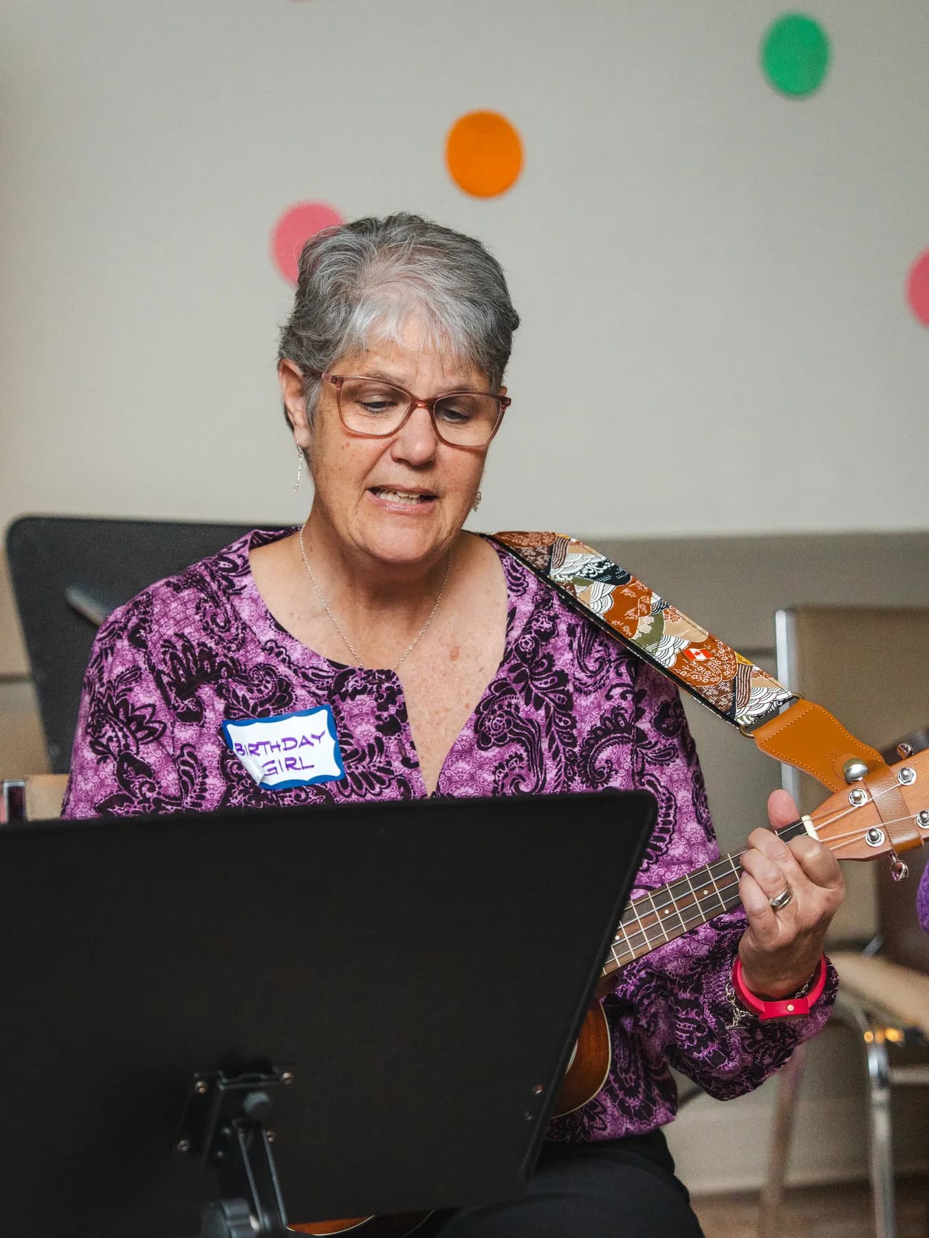 Musicians playing ukuleles at Alison’s birthday celebration.