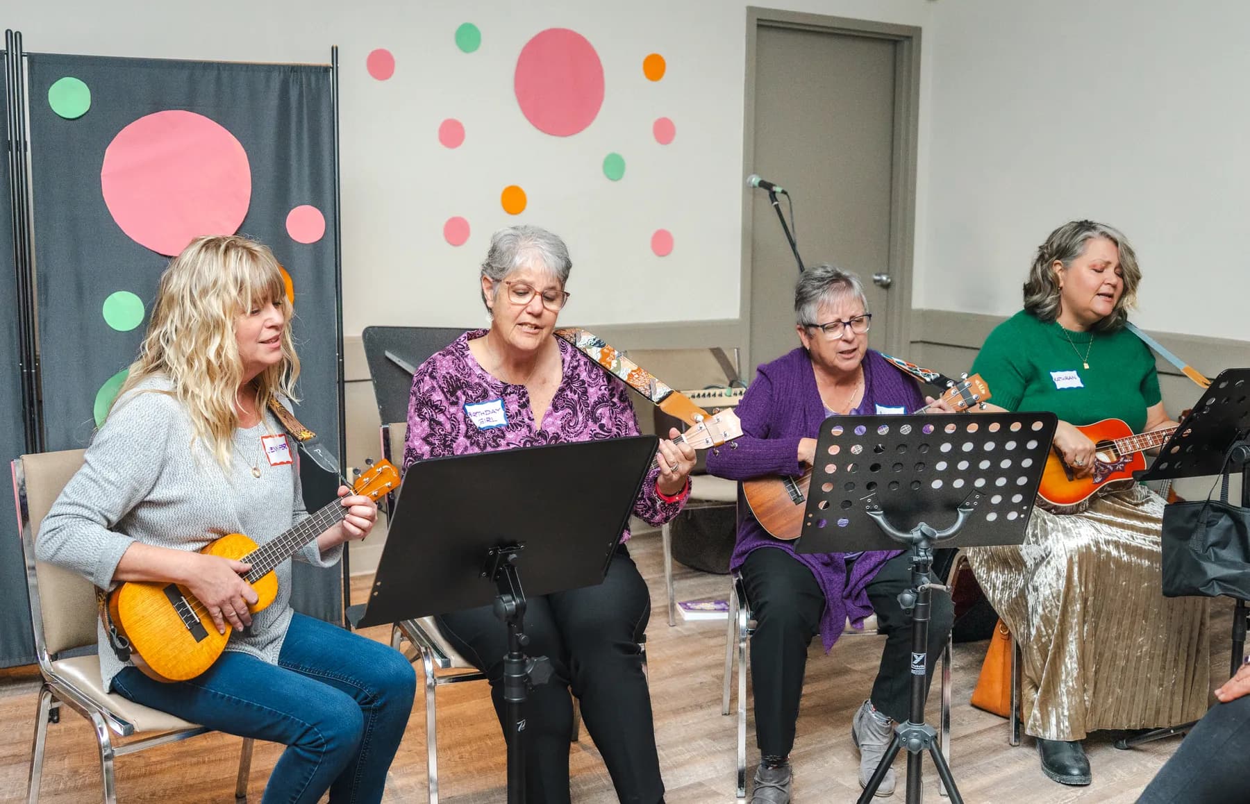 Musicians playing ukuleles at Alison’s birthday celebration.