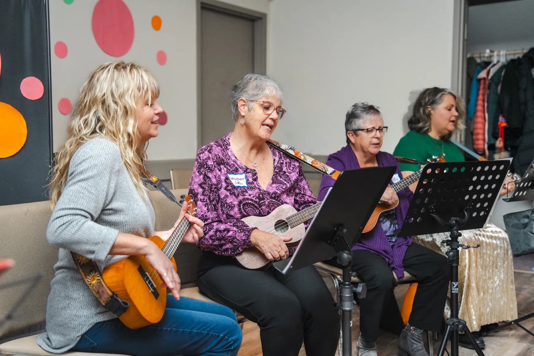 Musicians playing ukuleles at Alison’s birthday celebration.