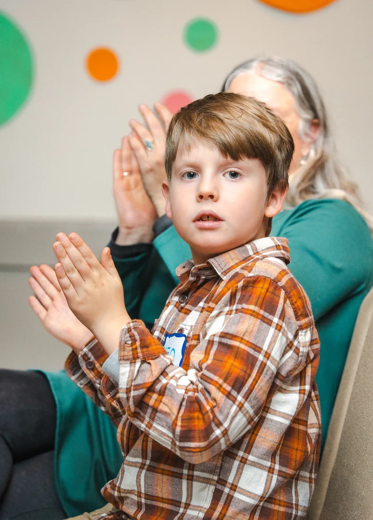 A child clapping at Alison’s birthday celebration.