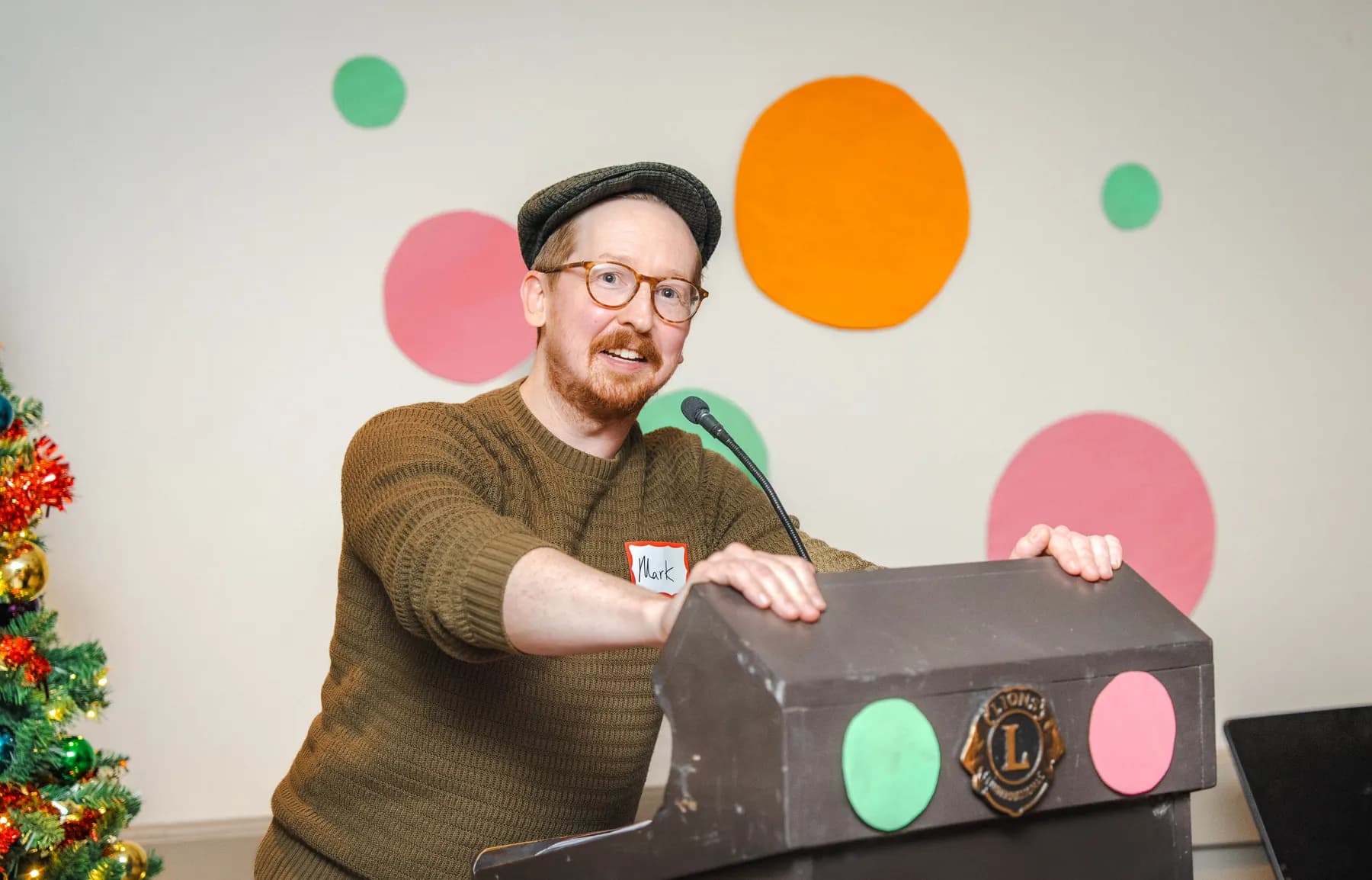 A man speaking at the lectern at Alison’s birthday celebration.
