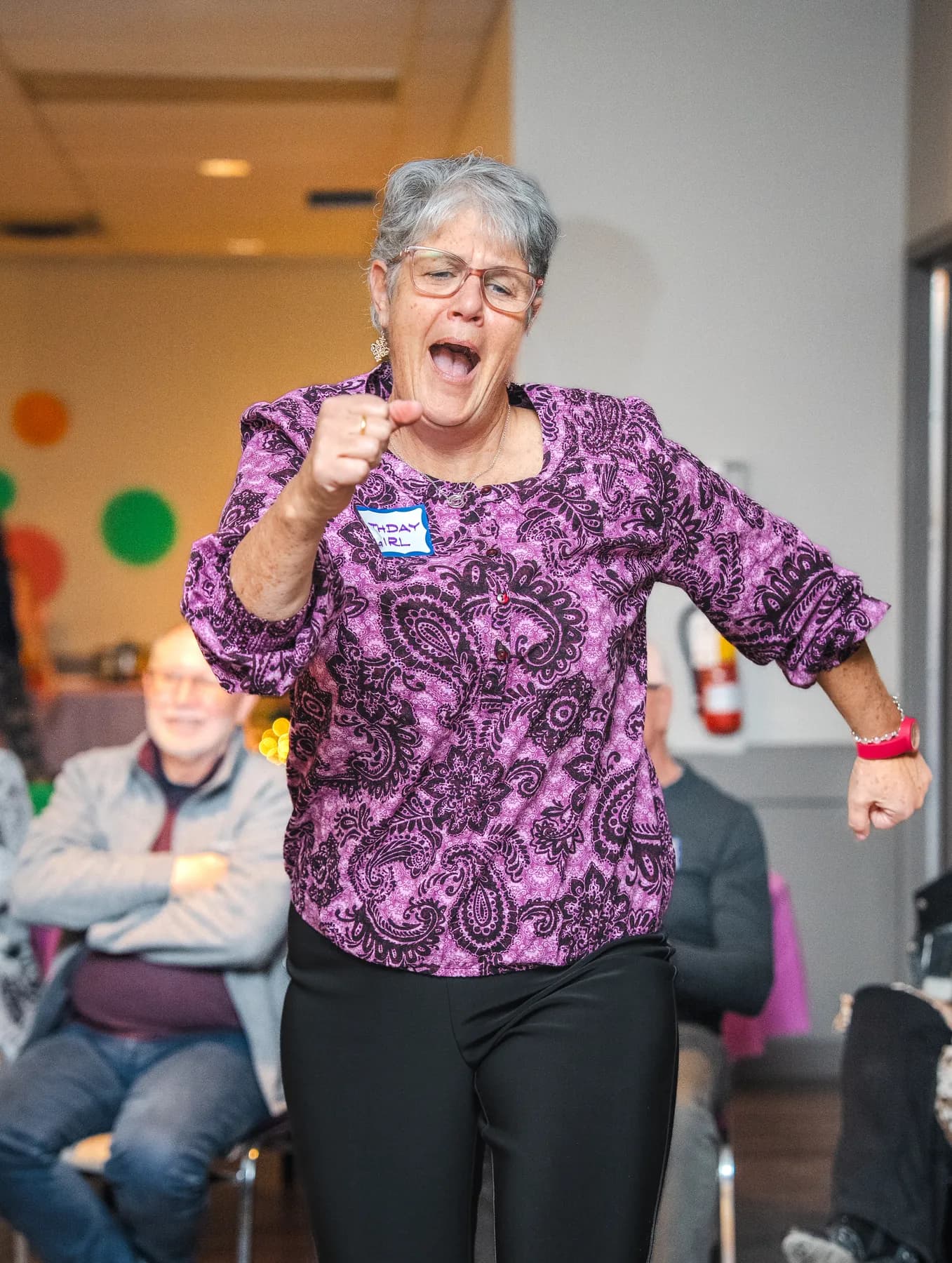 Guests taking part in a playful group performance at Alison’s birthday celebration.