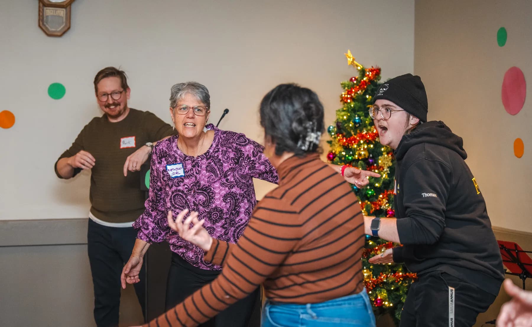 Guests taking part in a playful group performance at Alison’s birthday celebration.