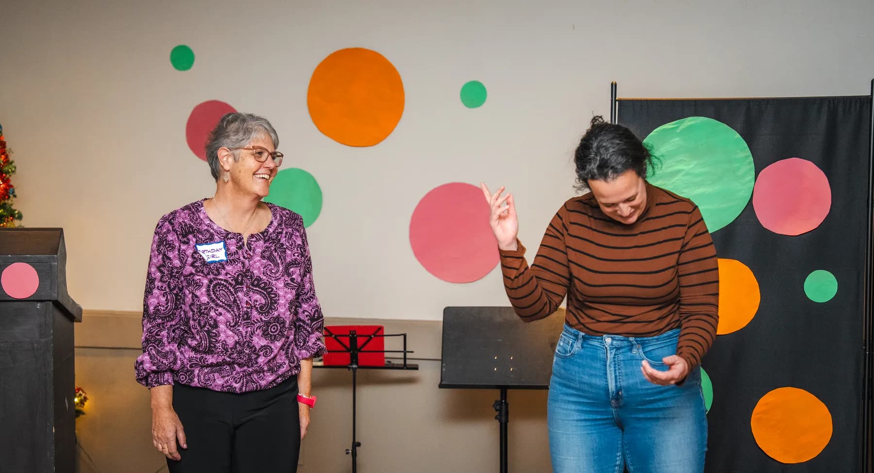 Guests taking part in a playful group performance at Alison’s birthday celebration.