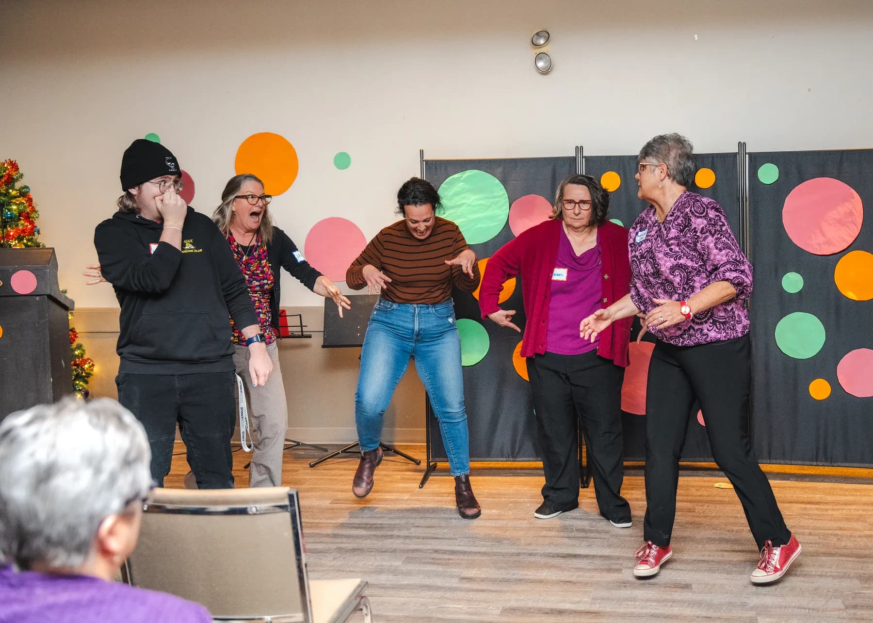 Guests taking part in a group performance at Alison’s birthday celebration.