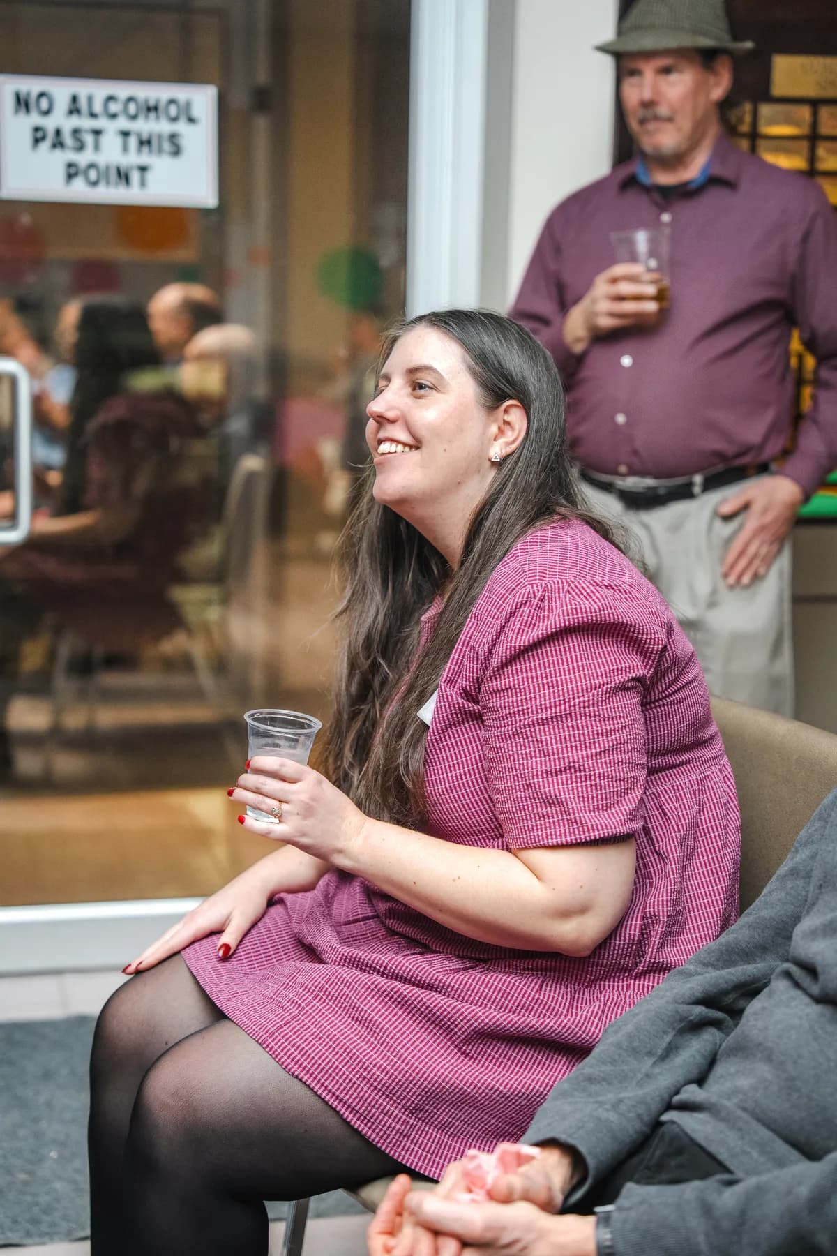 A woman clapping at Alison’s birthday celebration.