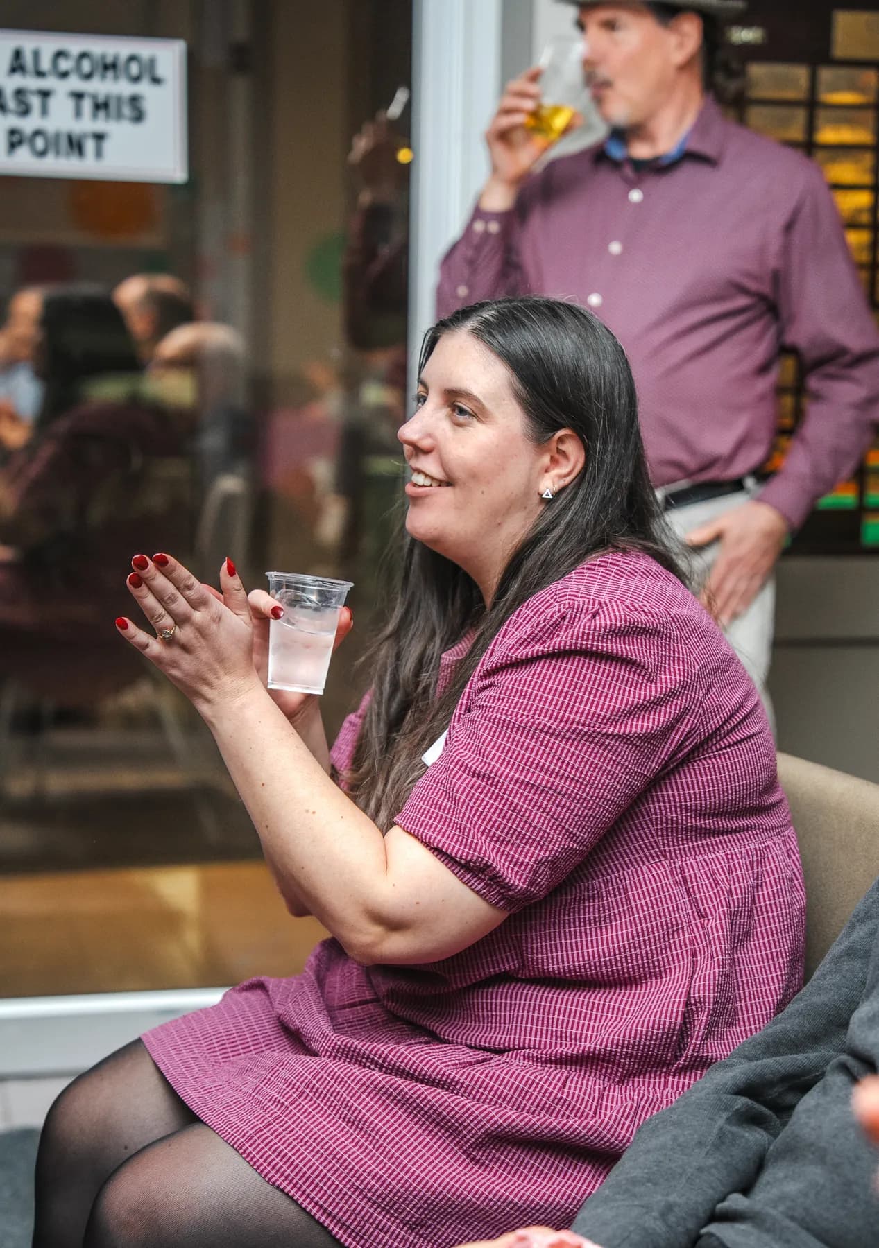 A woman clapping at Alison’s birthday celebration.