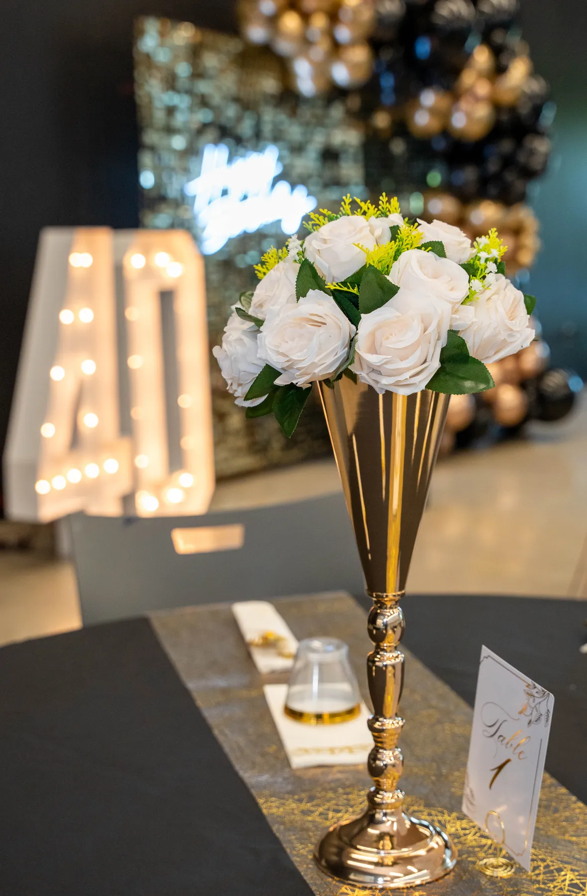 Party tables and black and gold decorations at BJ’s 40th birthday party.