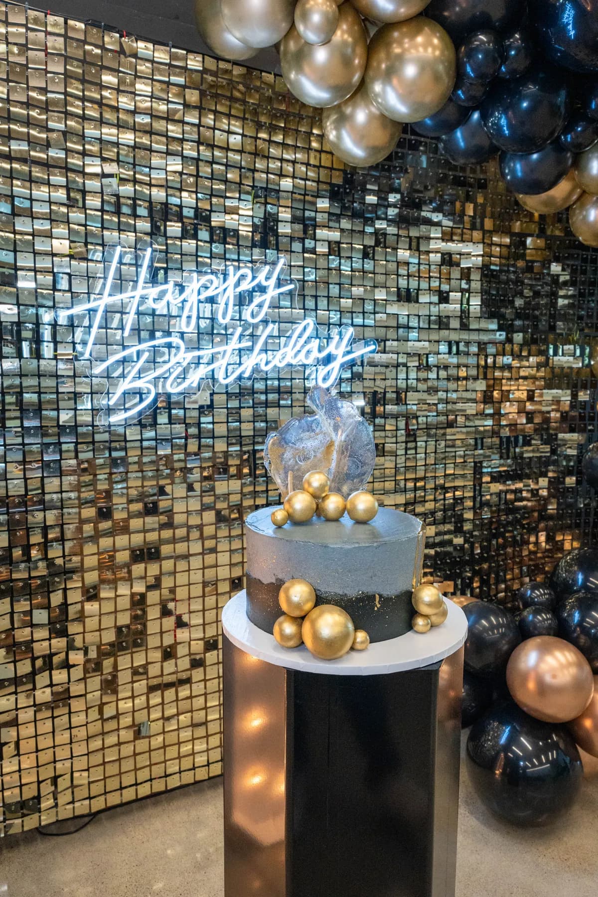 Party tables and black and gold decorations at BJ’s 40th birthday party.