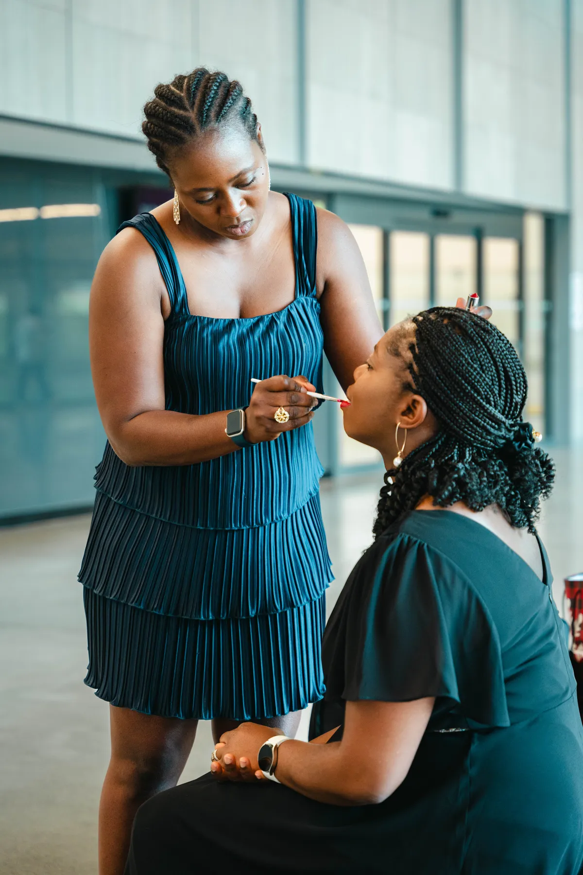 A woman helping a child at BJ’s 40th birthday party.